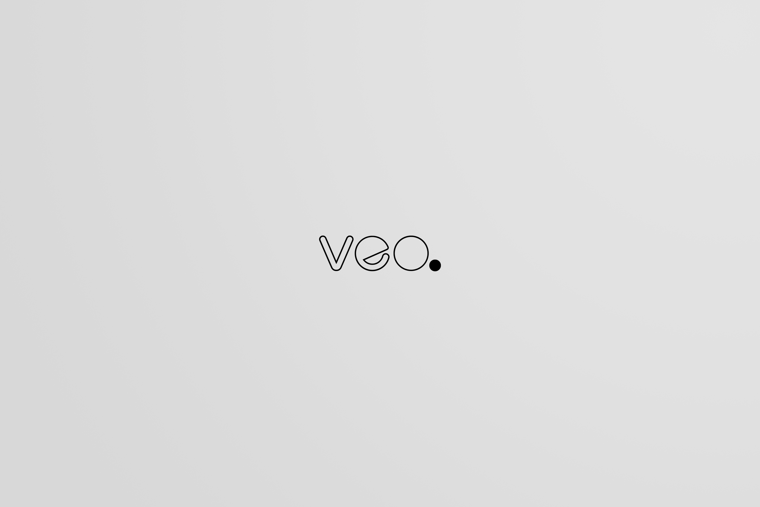 Minimalist grey background with the word 'veo.' in lowercase black outline font and a black period below the letter 'o'.
