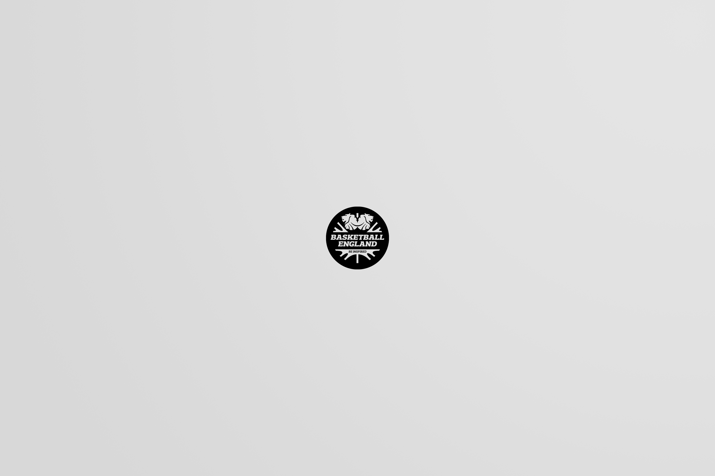 Small black and white circular logo with text 'Basketball England' and a figure of a basketball player below the words.