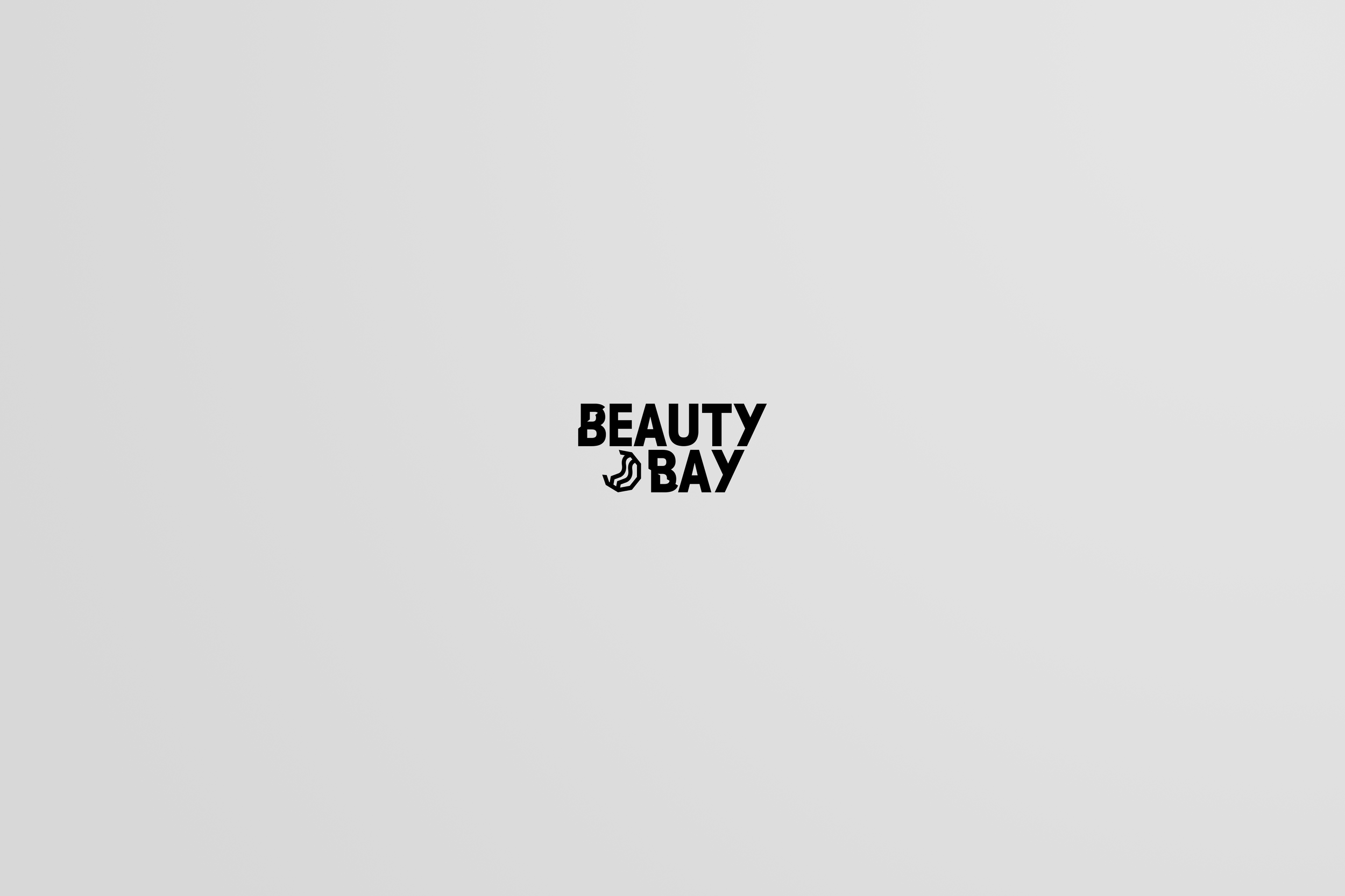 Black text saying 'Beauty Bay' on a light gray background with a small cosmetic brush icon.