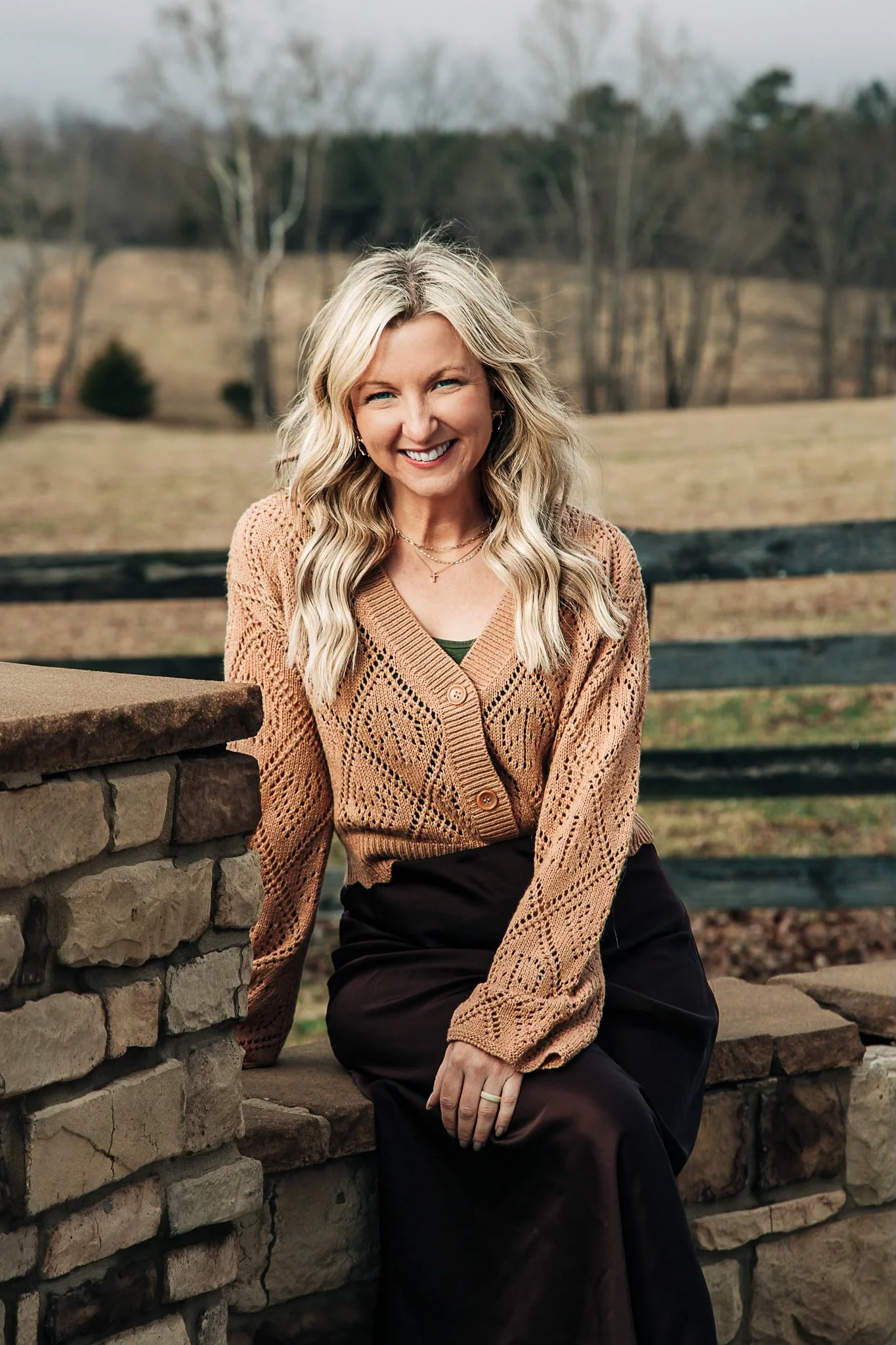 Elizabeth Lisic seated outdoors at Mustard Seed Ranch