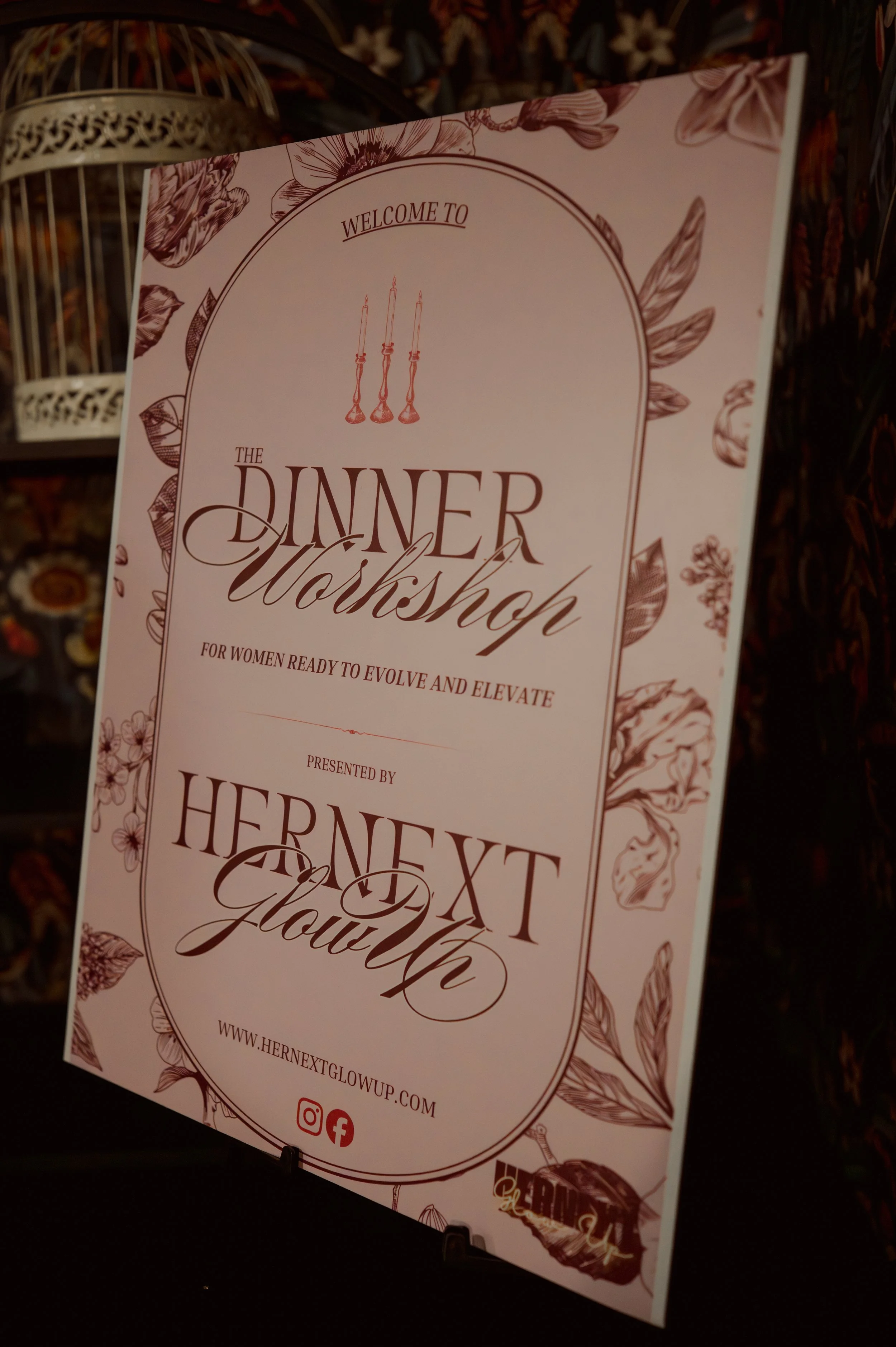 A pink and brown flyer for a dinner workshop for women, titled 'HerNext GlowUp,' with floral and candle illustrations, web address, and social media icons.