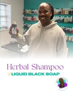 A smiling man holding a bottle of herbal shampoo in a store with shelves of hair products in the background. Text overlay reads 'Herbal Shampoo + Liquid Black Soap'.