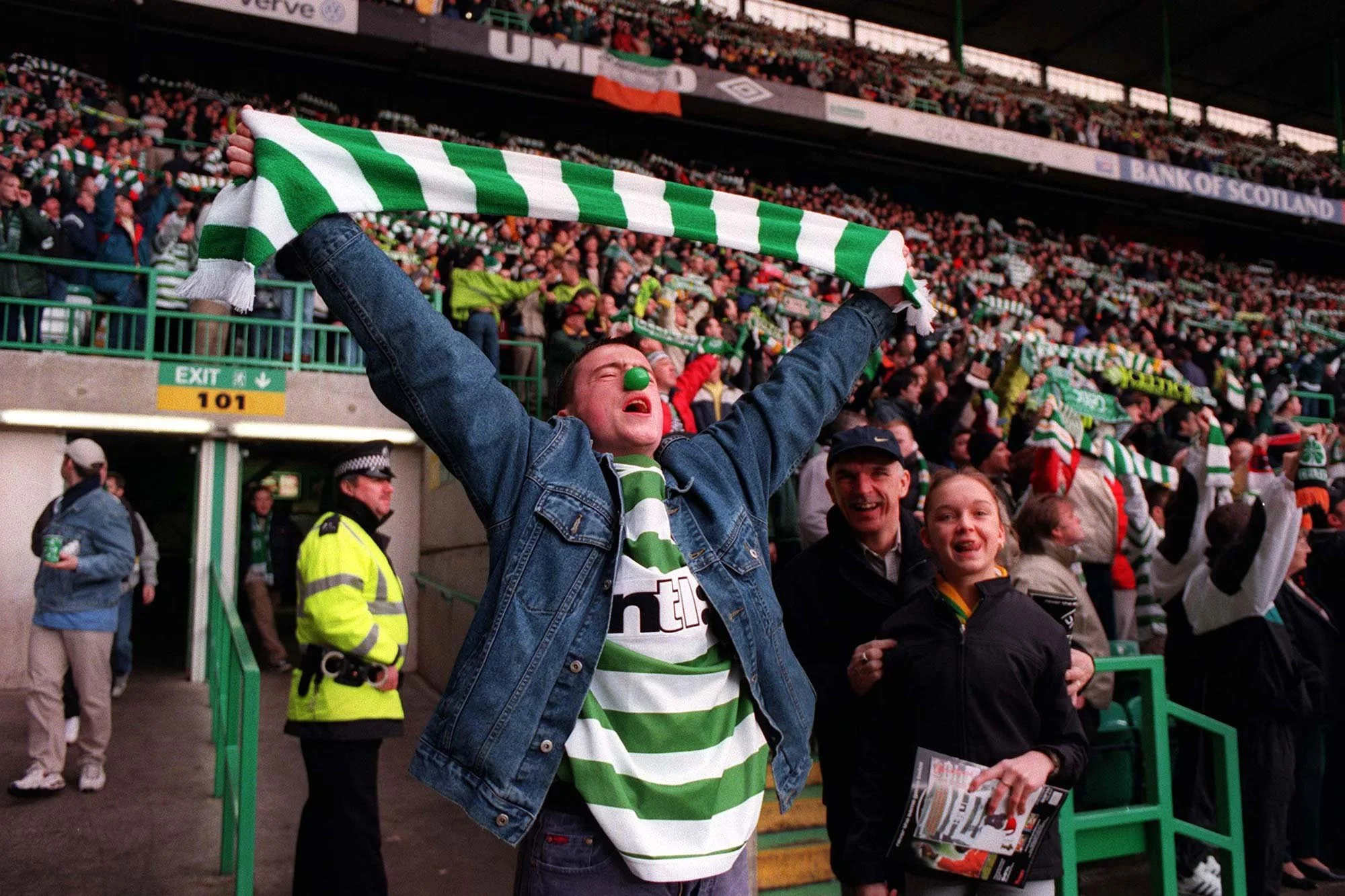Celtic v Rangers 
Celtic fans sing "You'll never walk alone".