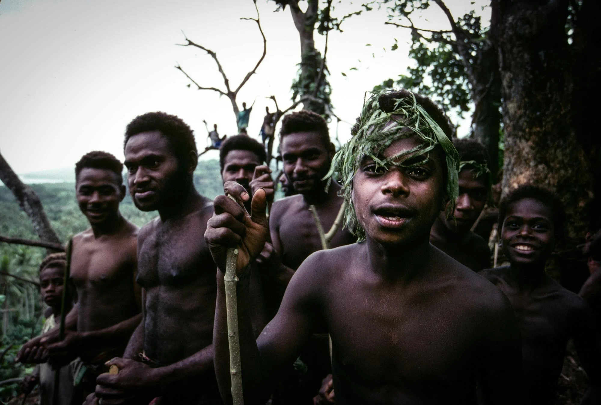 Tribe members wait for the start of the Naghol to begin. Naghol (or land diving) is a significant cultural ritual on Pentecost Island, Vanuatu, performed by men from April to June to ensure a bountiful yam harvest 