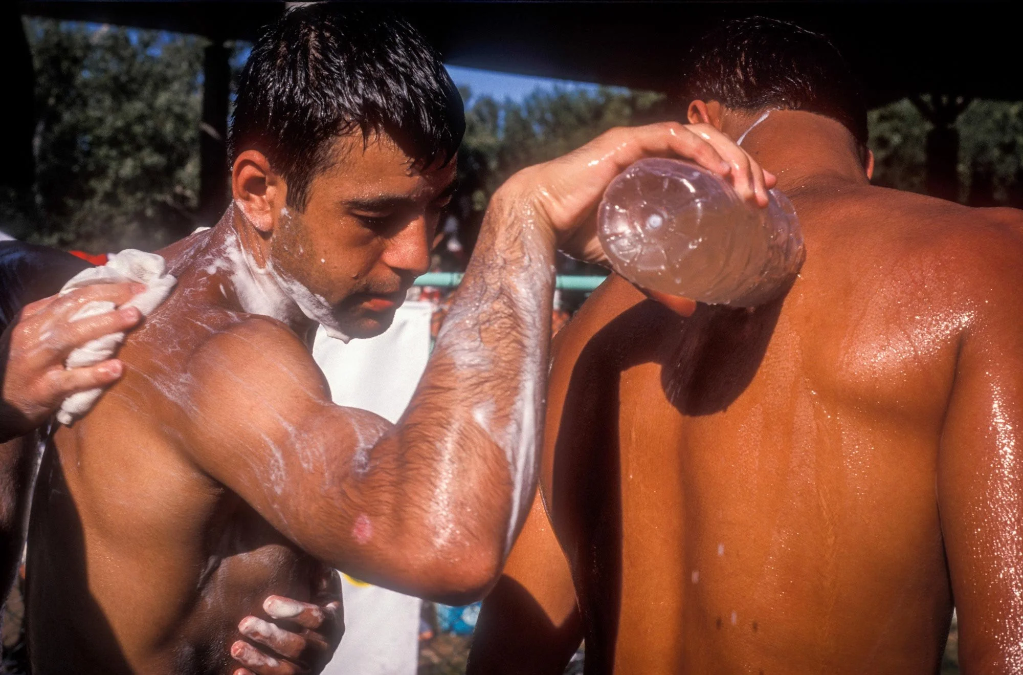 Kirkpinar Olive Oil Wrestling Festival, Edirne, Turkey. Wrestlers wash the oil from each other's bodies at the end of the first day's bouts.