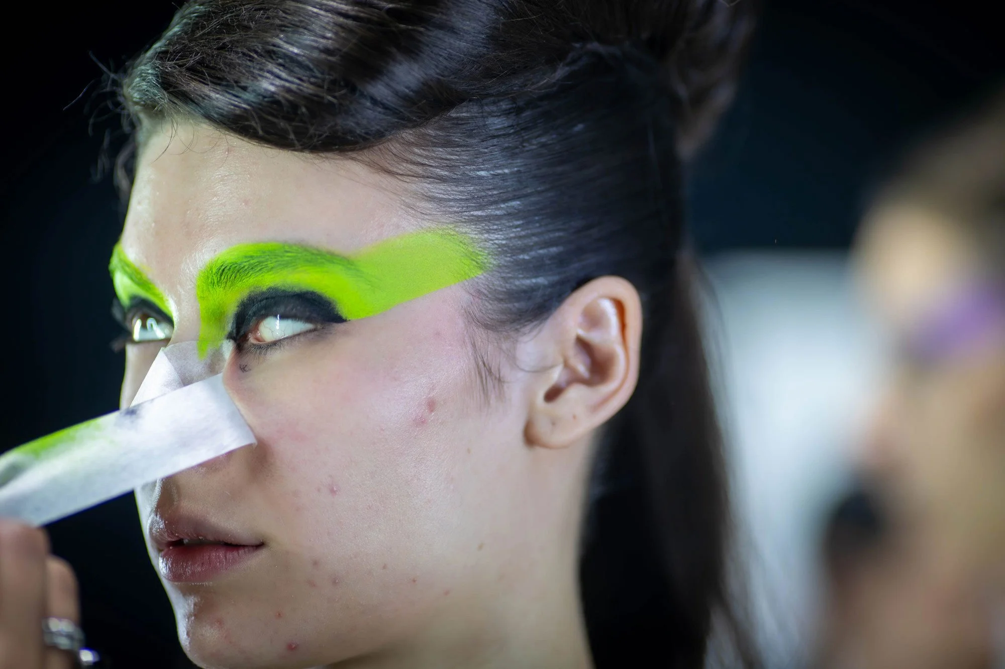 12:43 PM Masking tape is ripped off Hope’s face after make up for the Jacqueline Anne runway show is applied. Hope Phillips walks three runways shows on the first day of Kahuria - New Zealand Fashion Week.