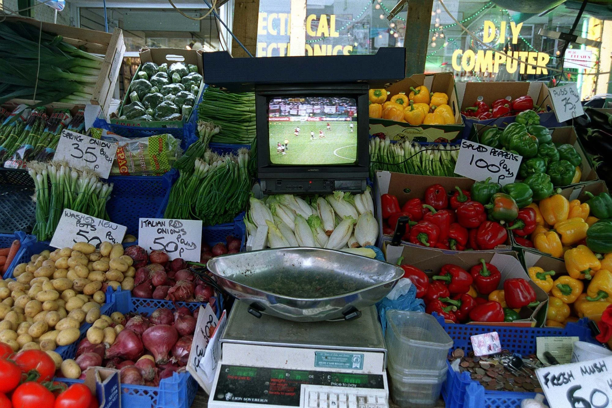 2002 FIFA World Cup. England v Argentina
Chapel market fruit and veg stall holder watches the game
