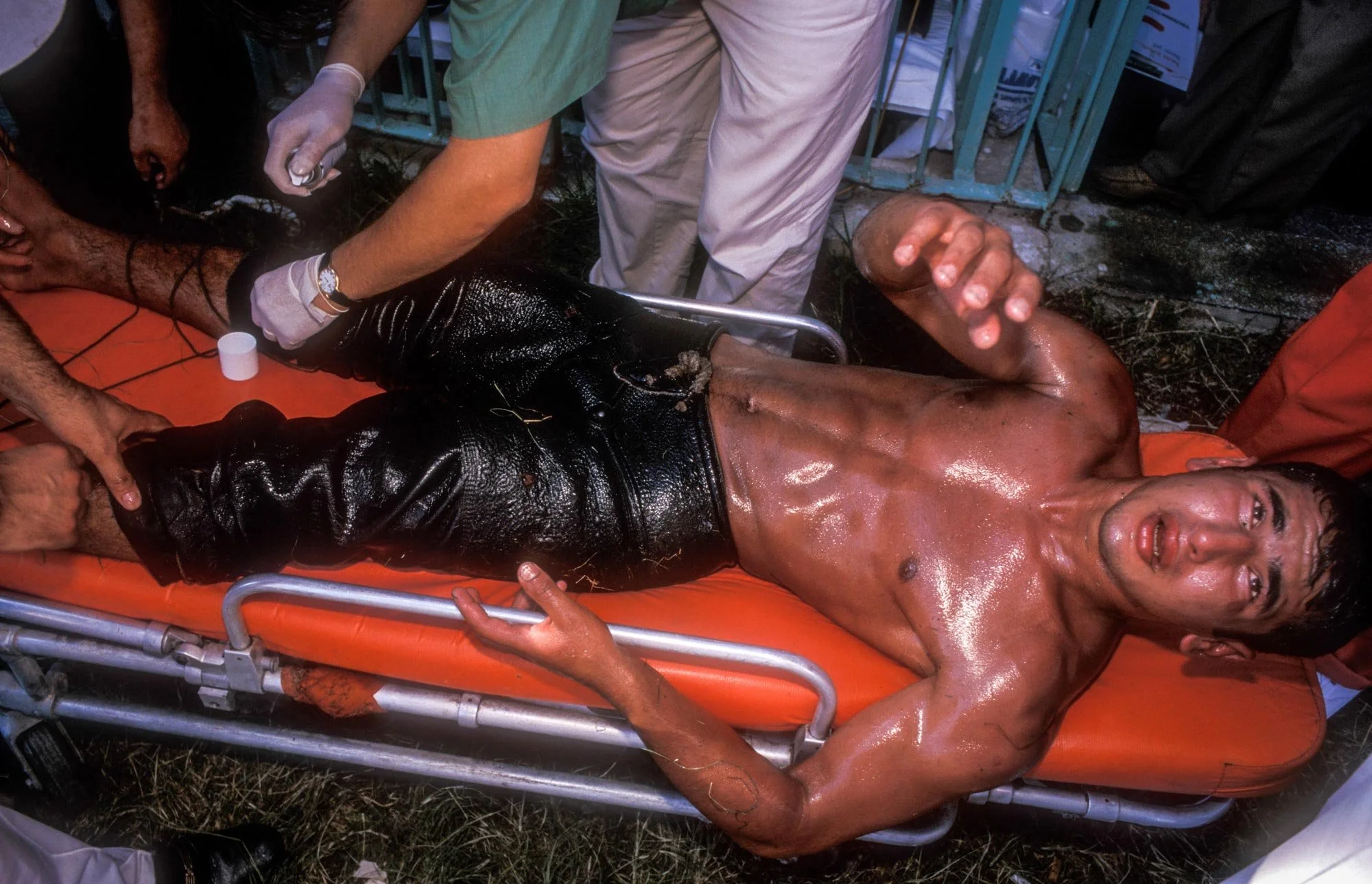 Kirkpinar Olive Oil Wrestling Festival, Edirne, Turkey. A stretcher-bound injured wrestler / Pehlivan receives treatment for injury.