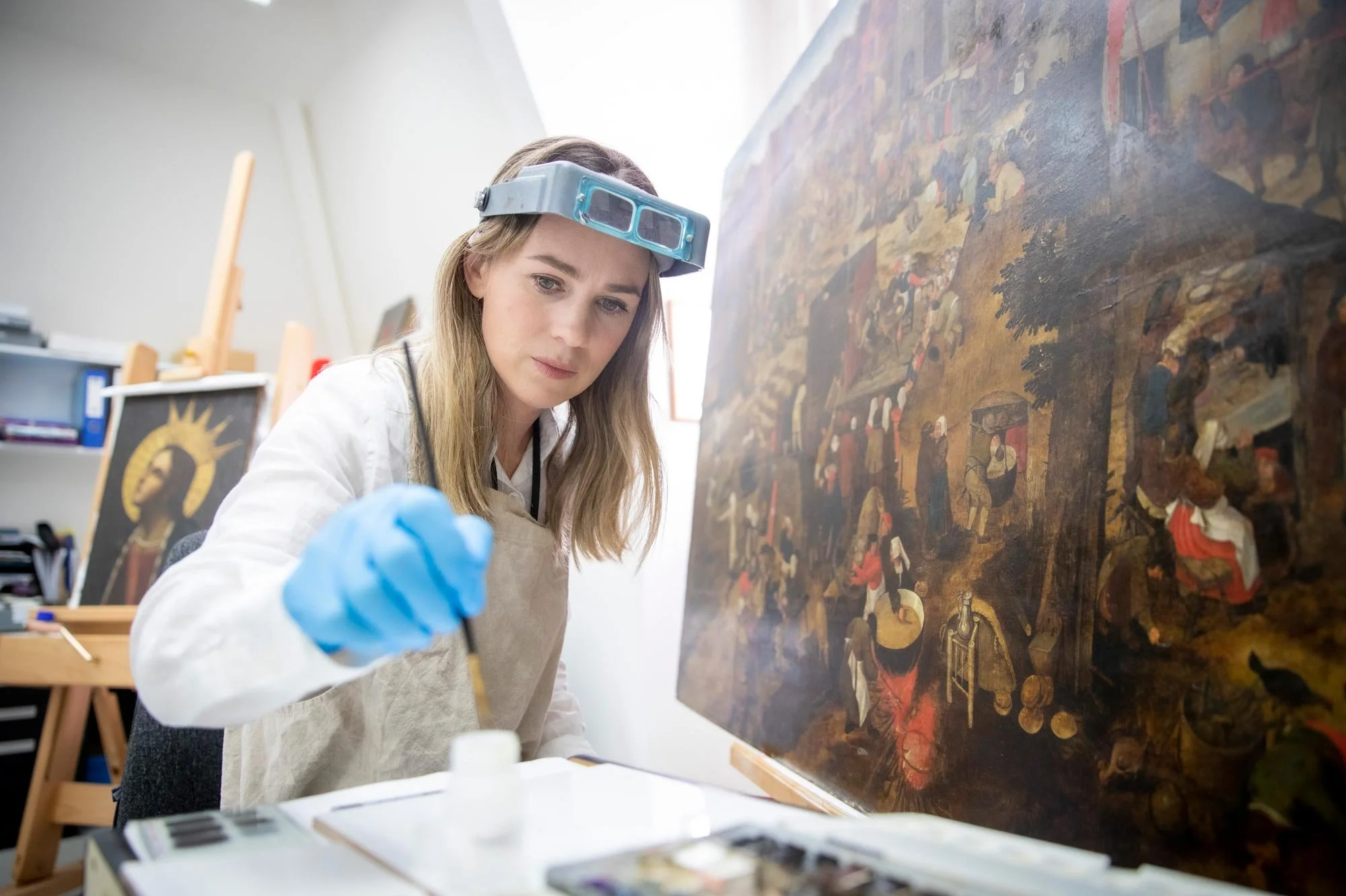 Auckland Art Gallery  Toi o Tāmaki conservator Genevieve Silvester works on painting by Pieter Bruegel the Younger . Photograph Michael Craig.