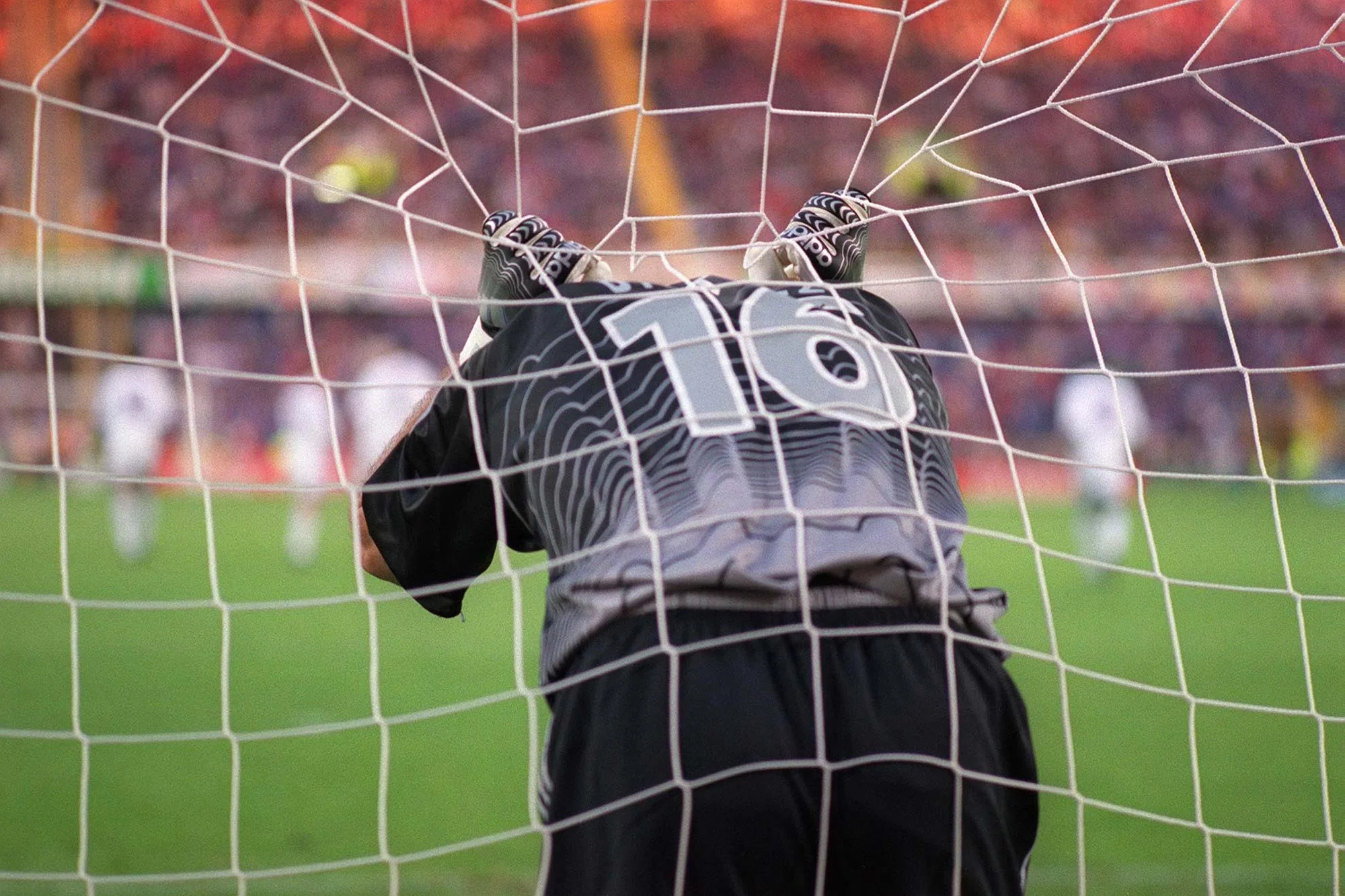 Spain - France. Euro 2000, Brugge.
Fabien Barthez, holds the net after failing to save Mendieta's penalty.
