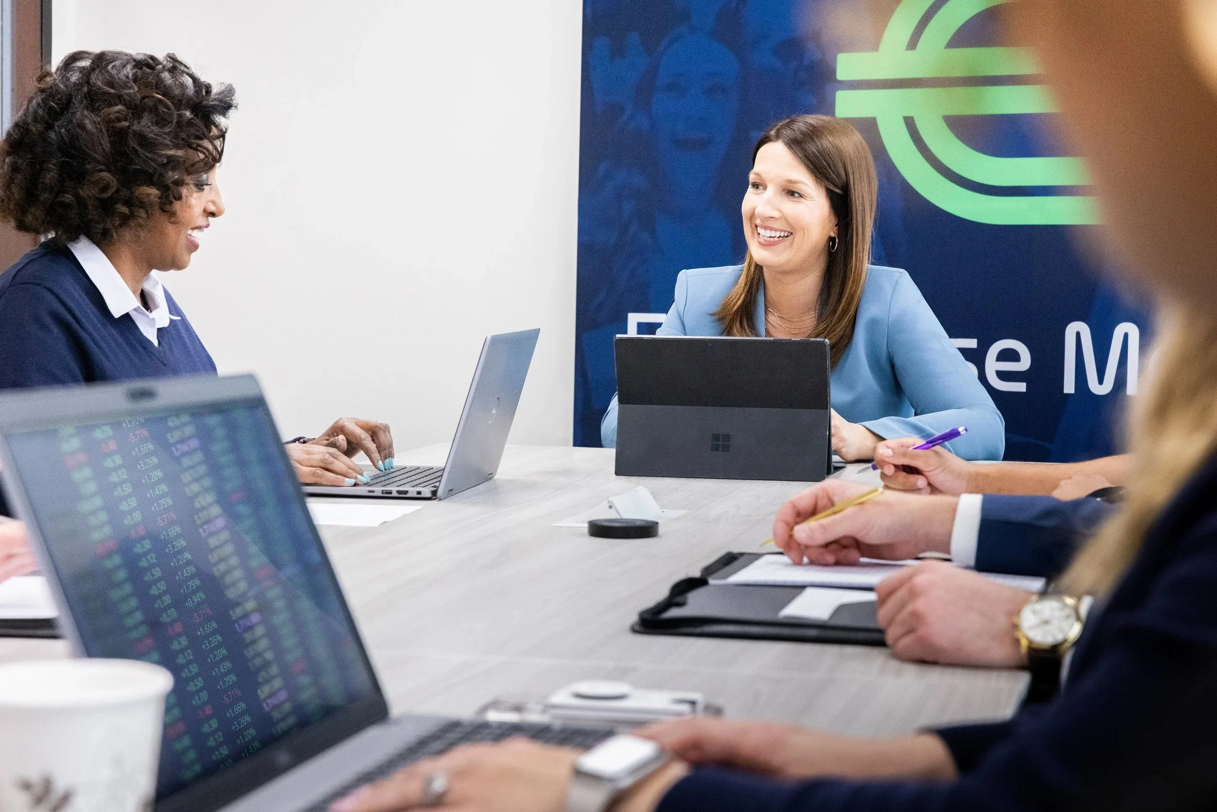 Business meeting with women and men in an office conference room in DFW. near the airport.