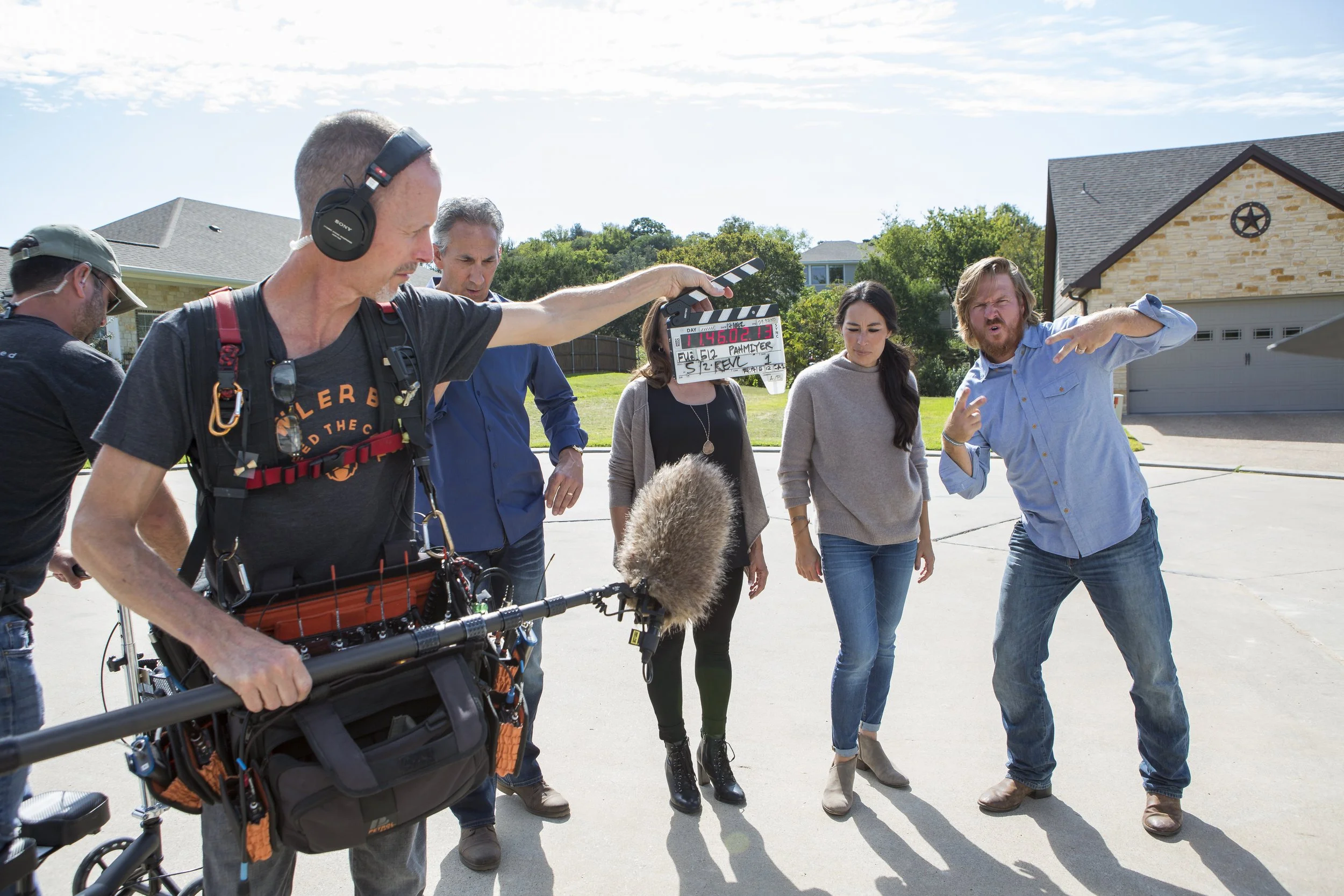 Behind the scenes with Chip and Joanna Gaines as the production crew slates a scene for HGTV’s Fixer Upper in Waco, Texas. Photography by Jennifer Boomer.