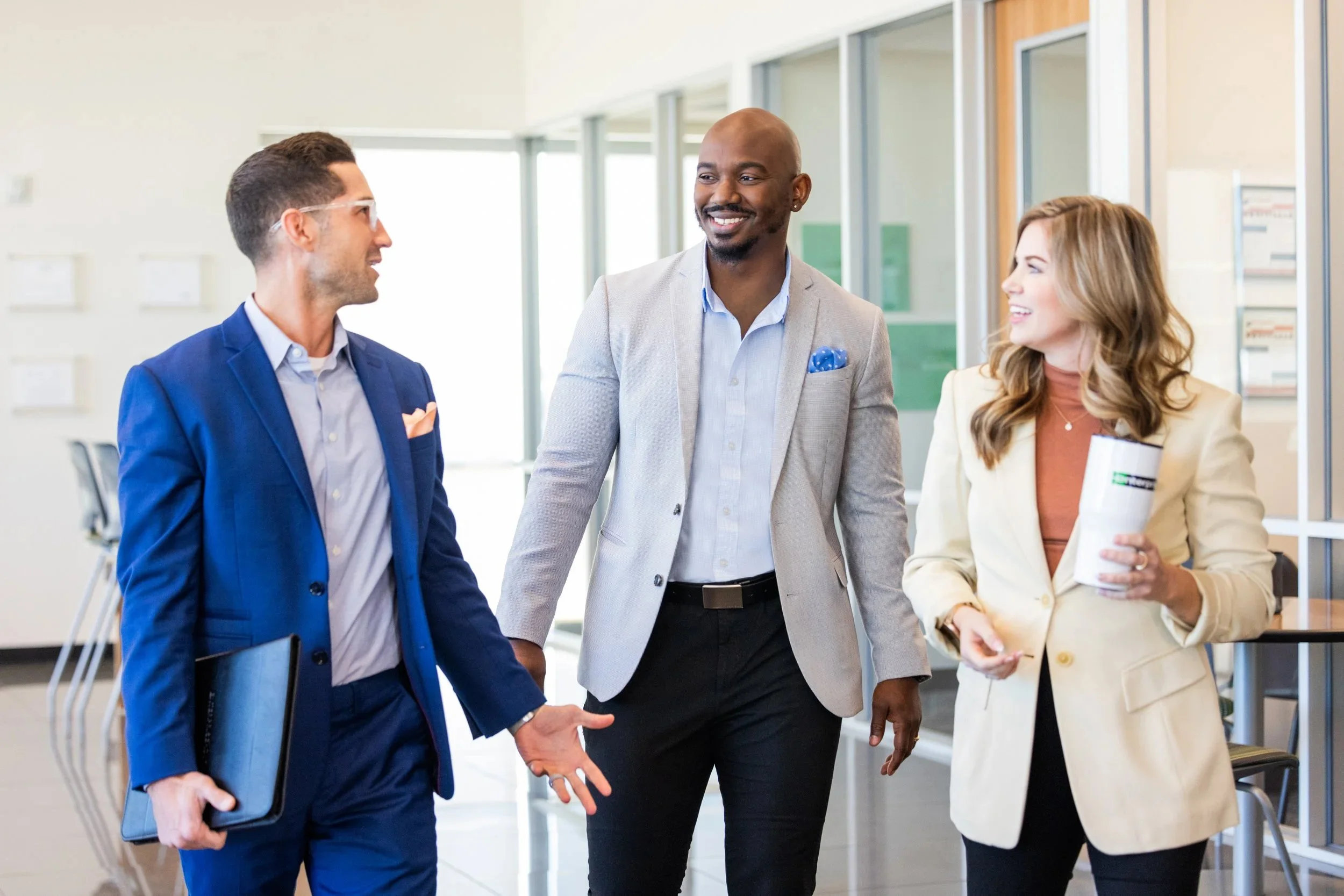 corporate employees at enterprise walk through the building