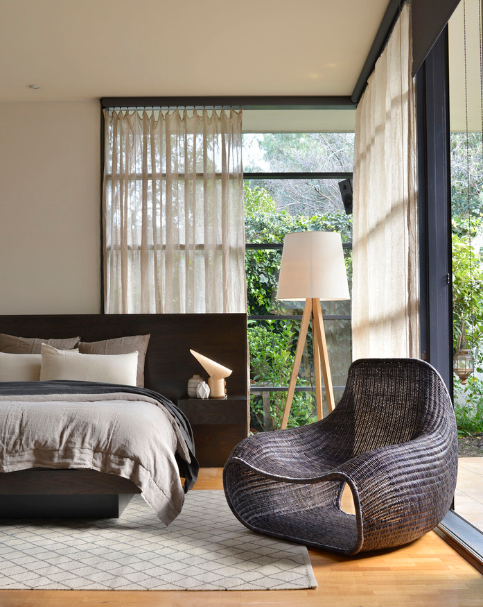 Neutral textured rug in modern bedroom with natural light