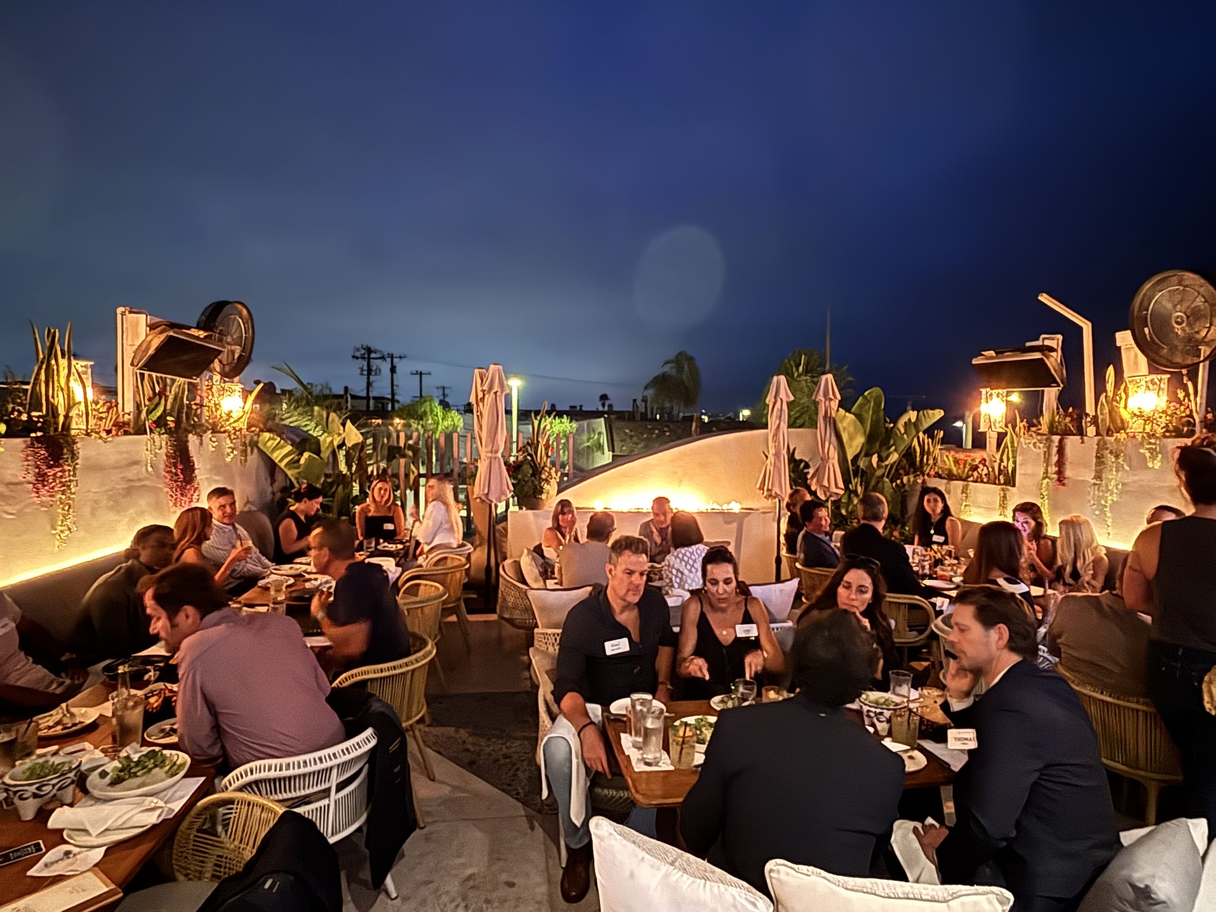 Members and partners on the rooftop at Esperanza Cocina, Manhattan Beach.