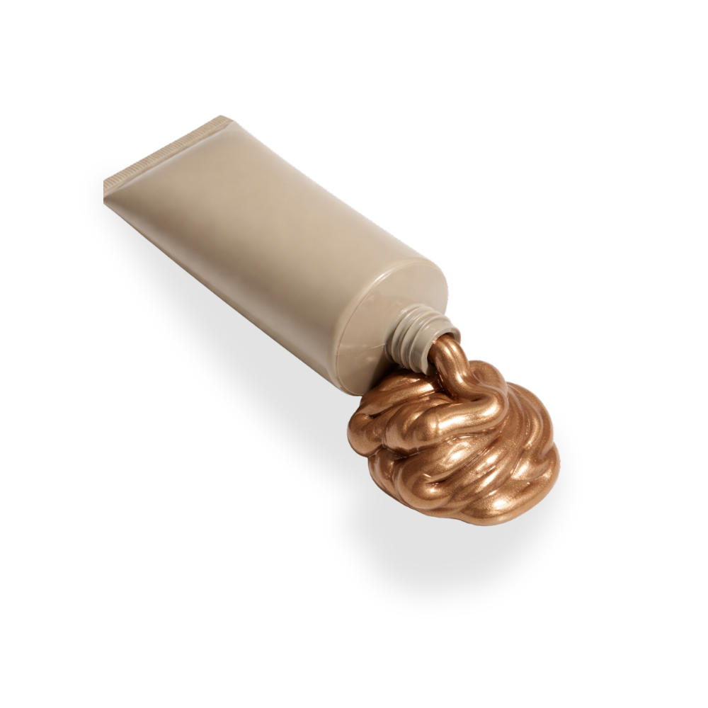Beige squeeze bottle of cleantan with metallic bronze slime oozing out.