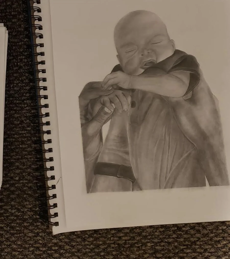 A detailed, grayscale pencil drawing of a young child being held up in the air by both parents hands, with one adults hand holding the child's hand.