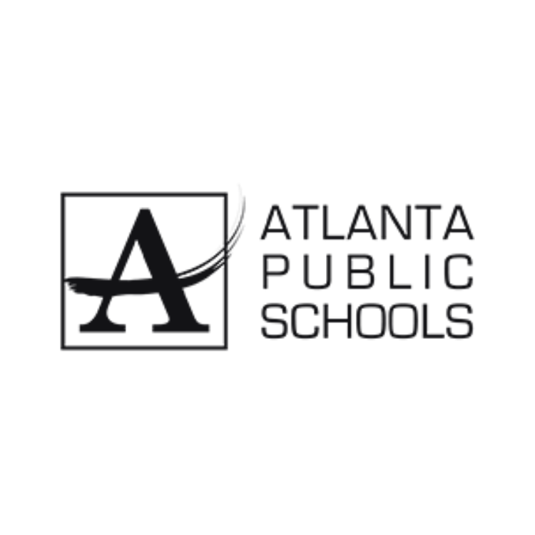 A street scene at night with buildings, streetlights, and a traffic light in the foreground.