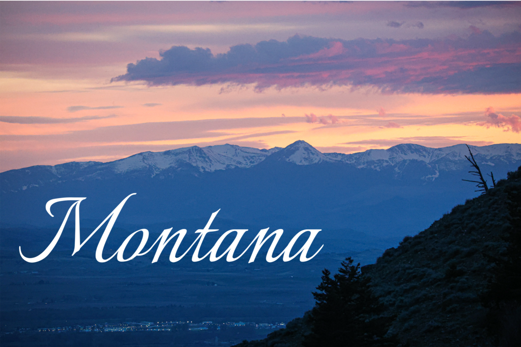 Scenic view of snow-capped mountains during sunset with a colorful sky, and the word 'Montana' written in elegant cursive text.