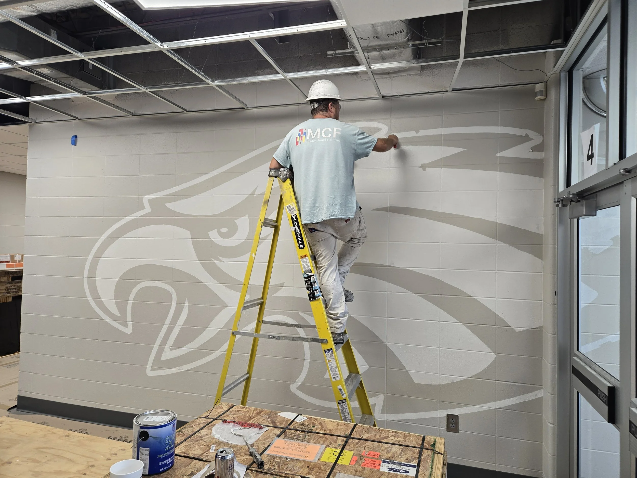 Painting Joplin eagle at McKinley elementary school commercial project