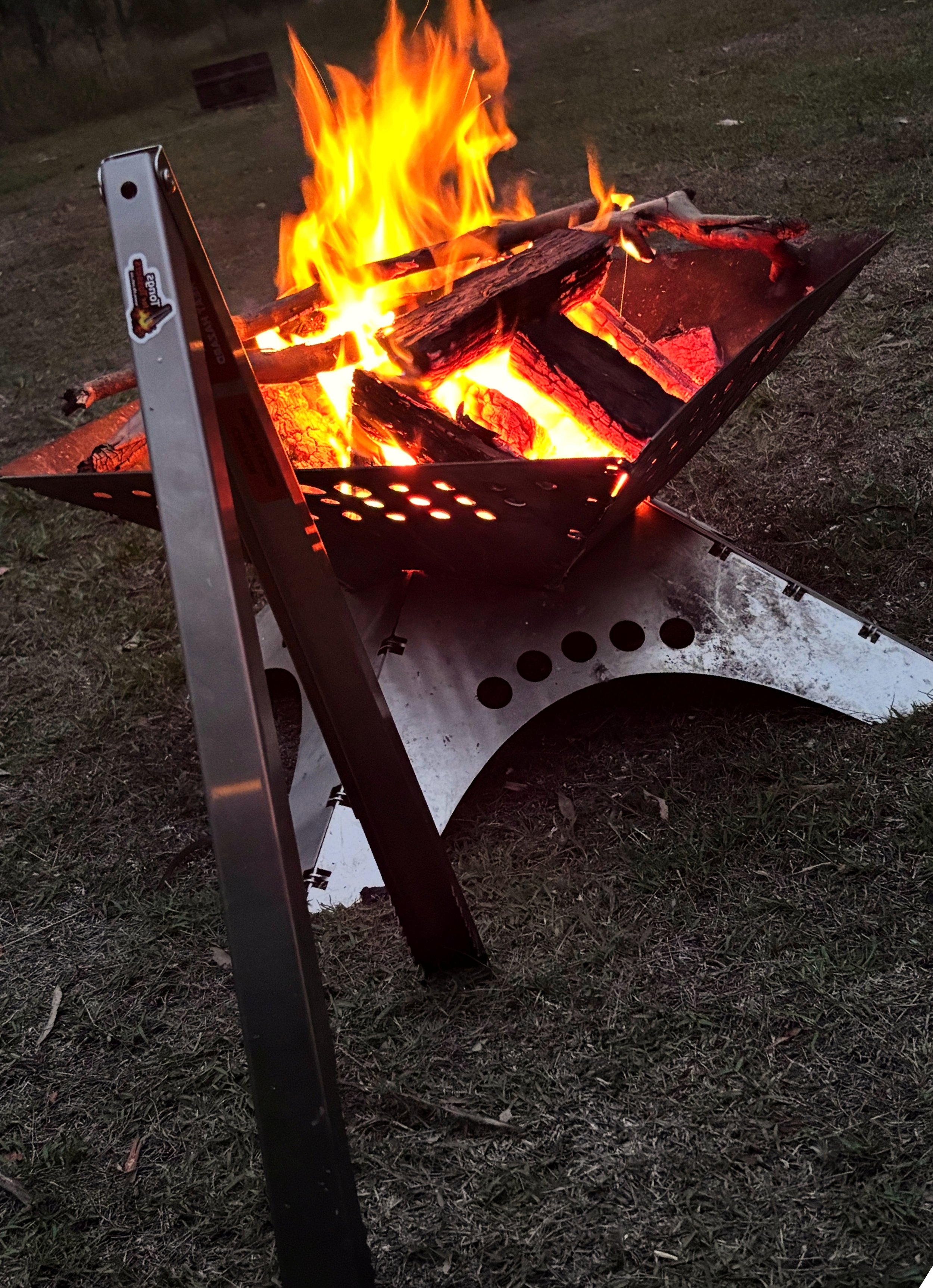 Tongs for Tossers Australian Made Campfire Tongs at a campfire with friends