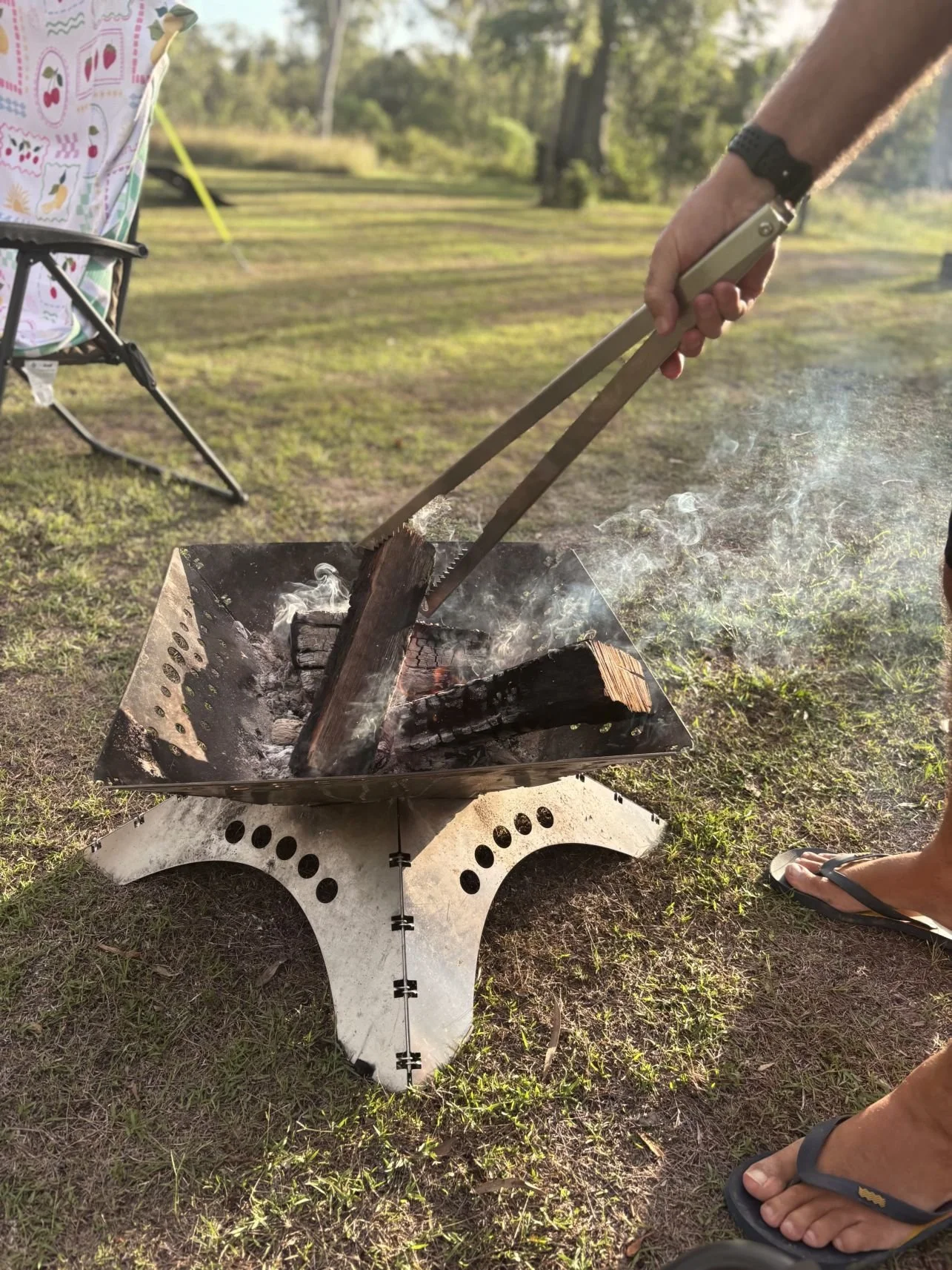Fire Tong Tongs for Tossers being used in a fire pit