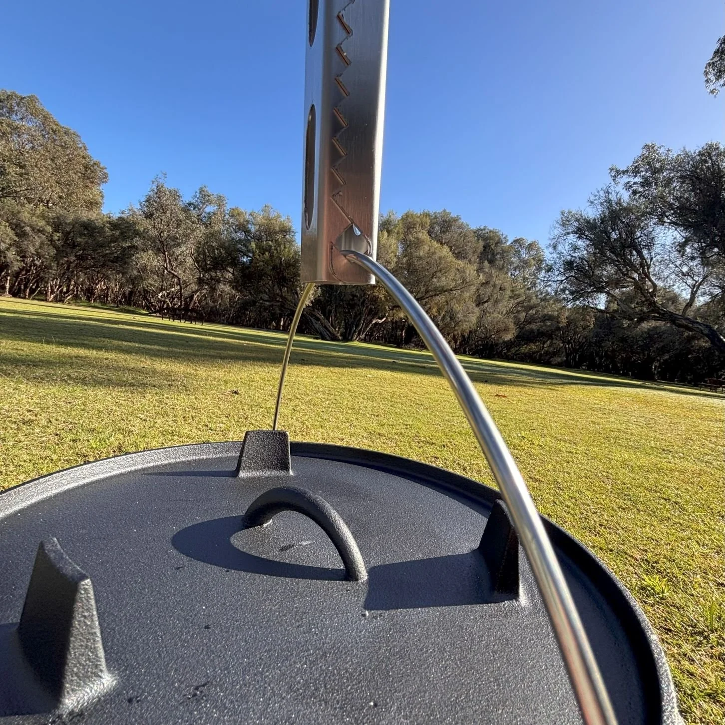 Tongs for Tossers has a tight and safe grip on the camp oven handle