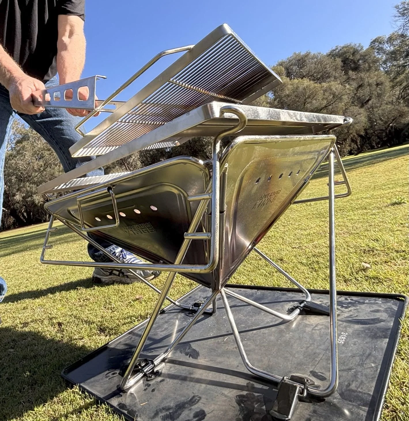 Lift your hot grill from a flaming fire pit