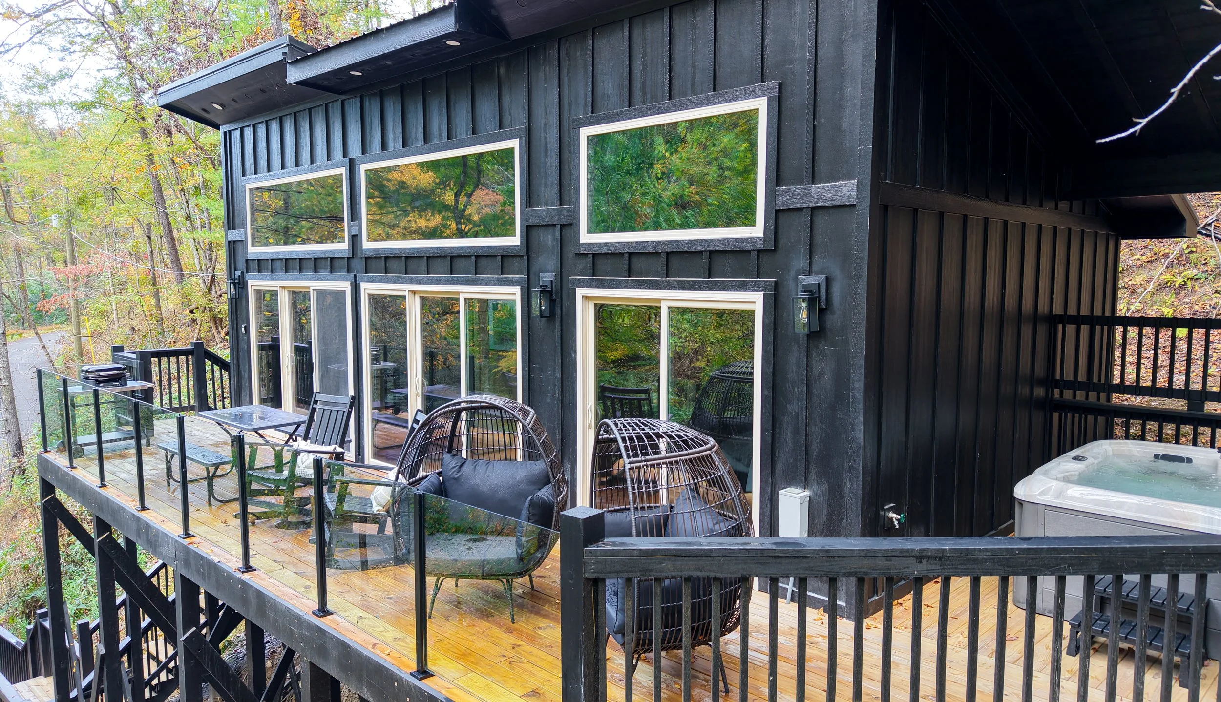 Modern black cabin with large windows in the Smoky Mountains of Tennessee
