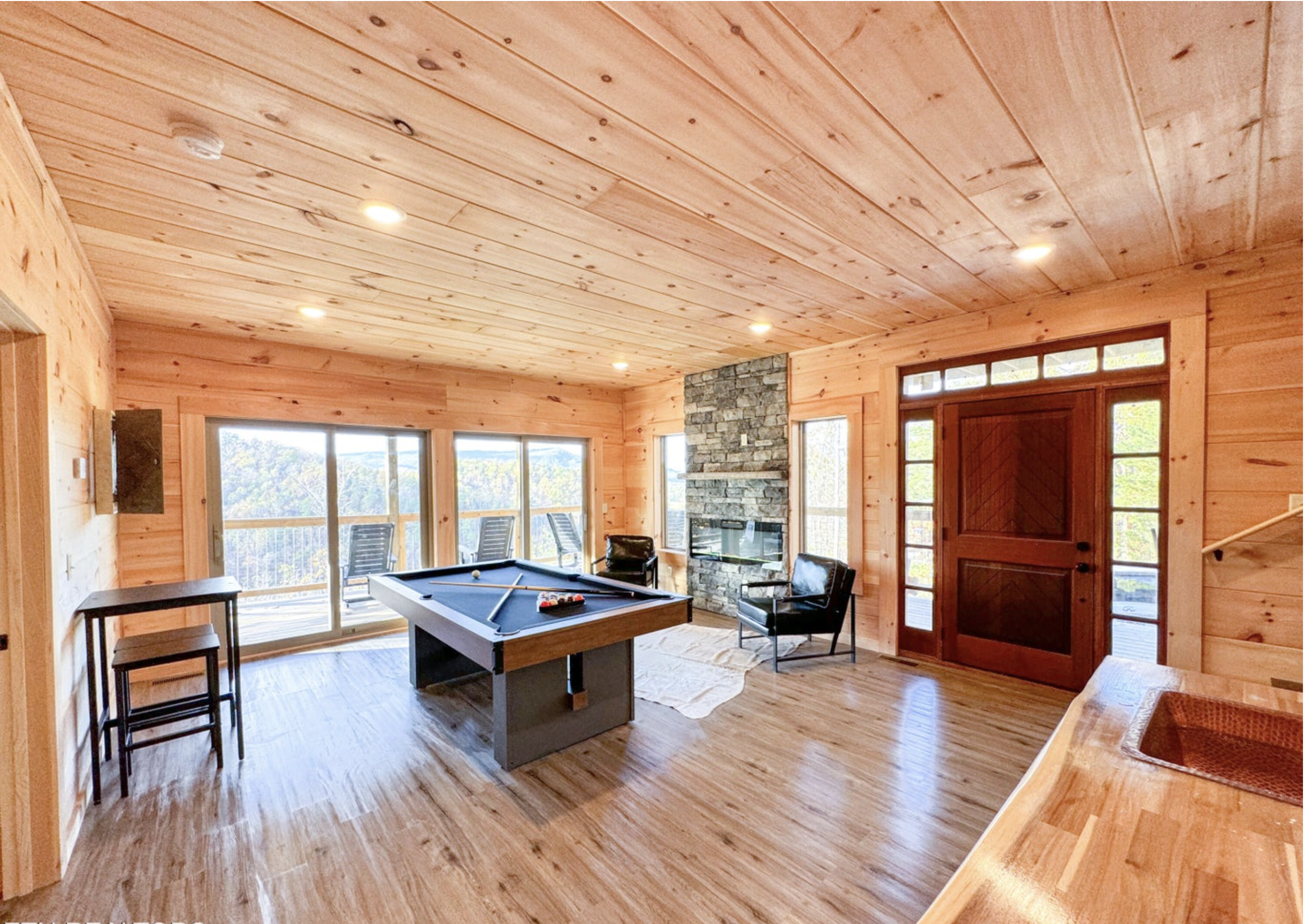 Open kitchen and dining area in a modern Smoky Mountain cabin
