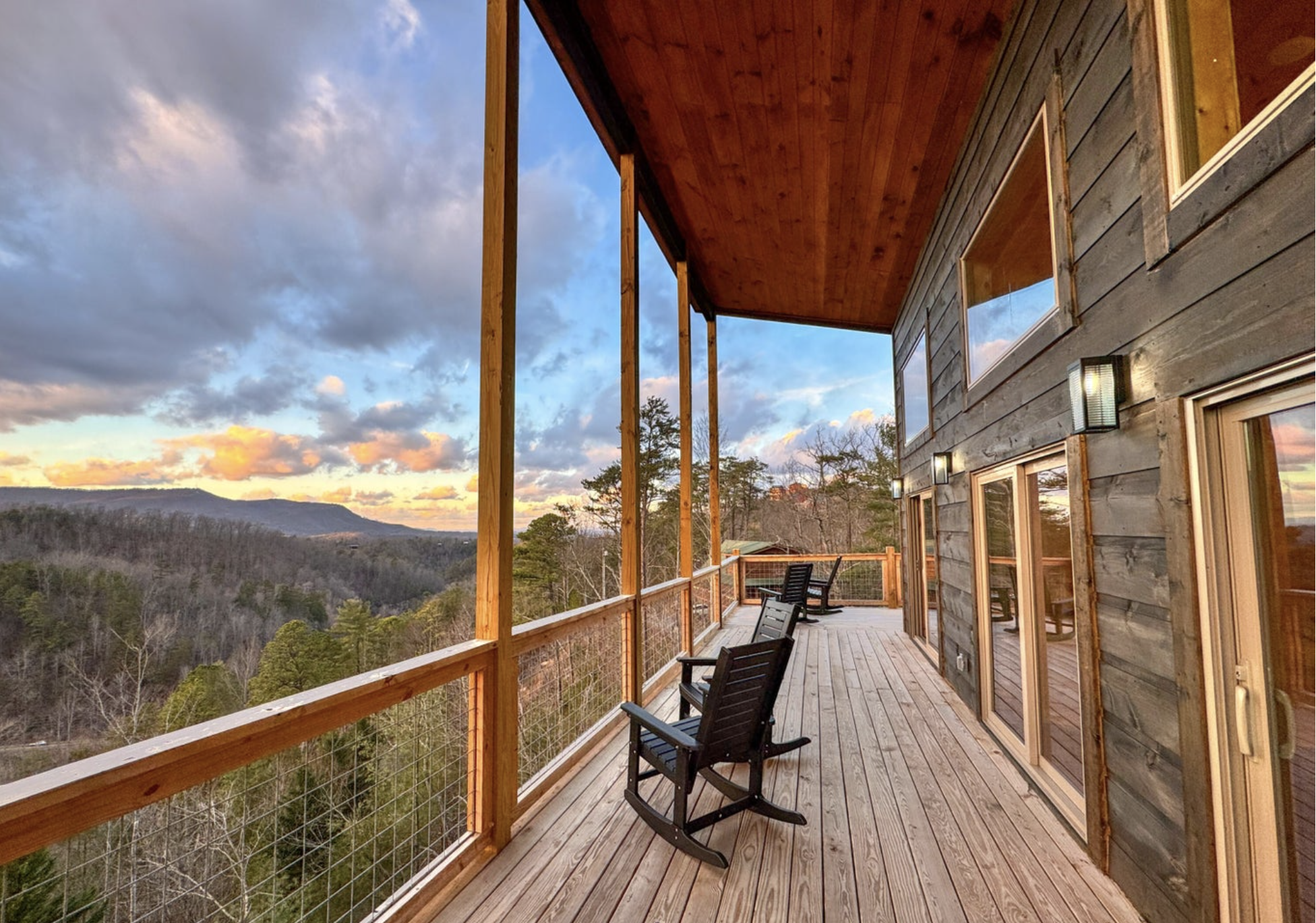 Cabin balcony with rocking chairs overlooking the Smoky Mountains

