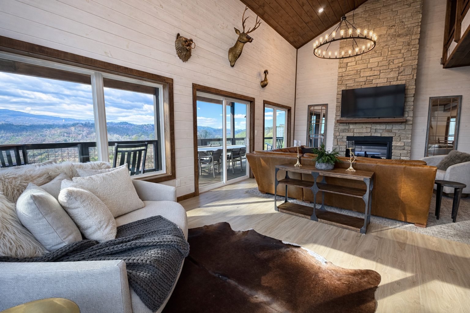 Spacious great room with modern furnishings, wood ceilings, and scenic Gatlinburg mountain views.