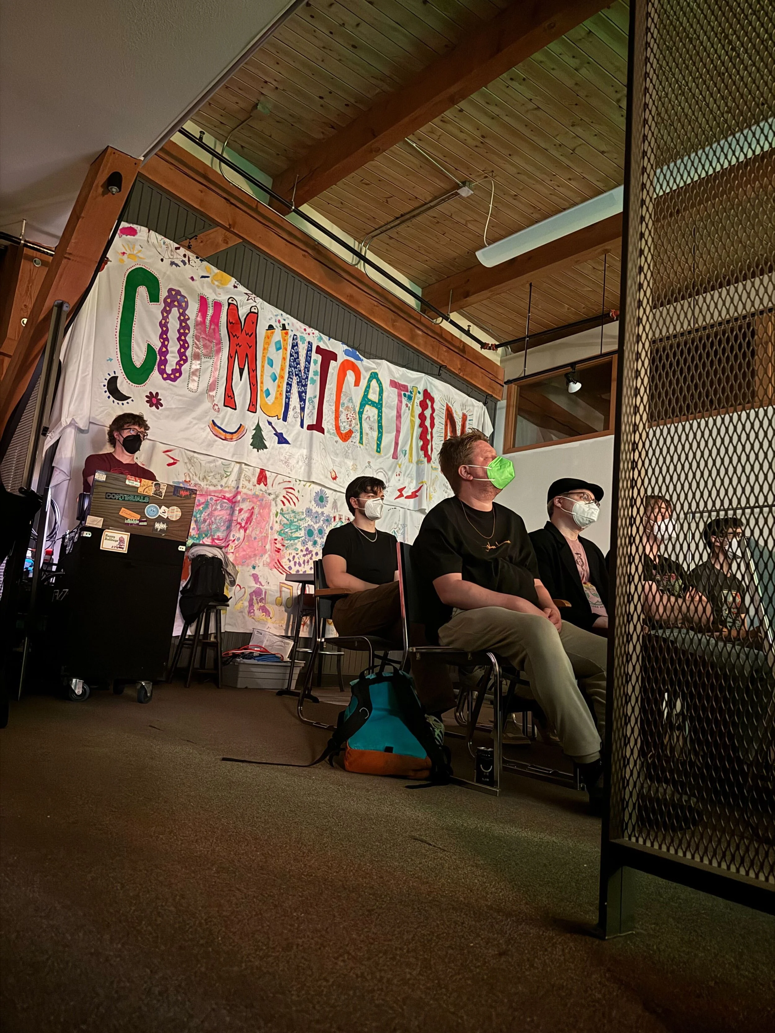 audience wearing masks watching band play live at communication madison