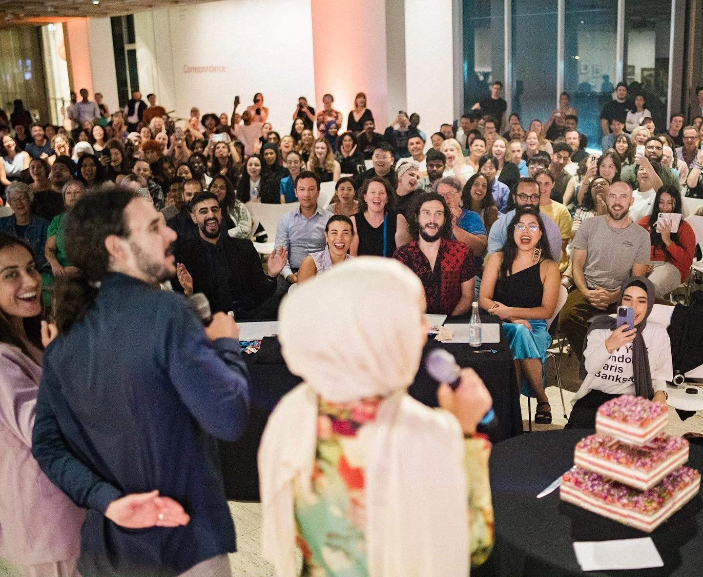 A large group of people attending the 10 year anniversary for bankstown poetry slam.
