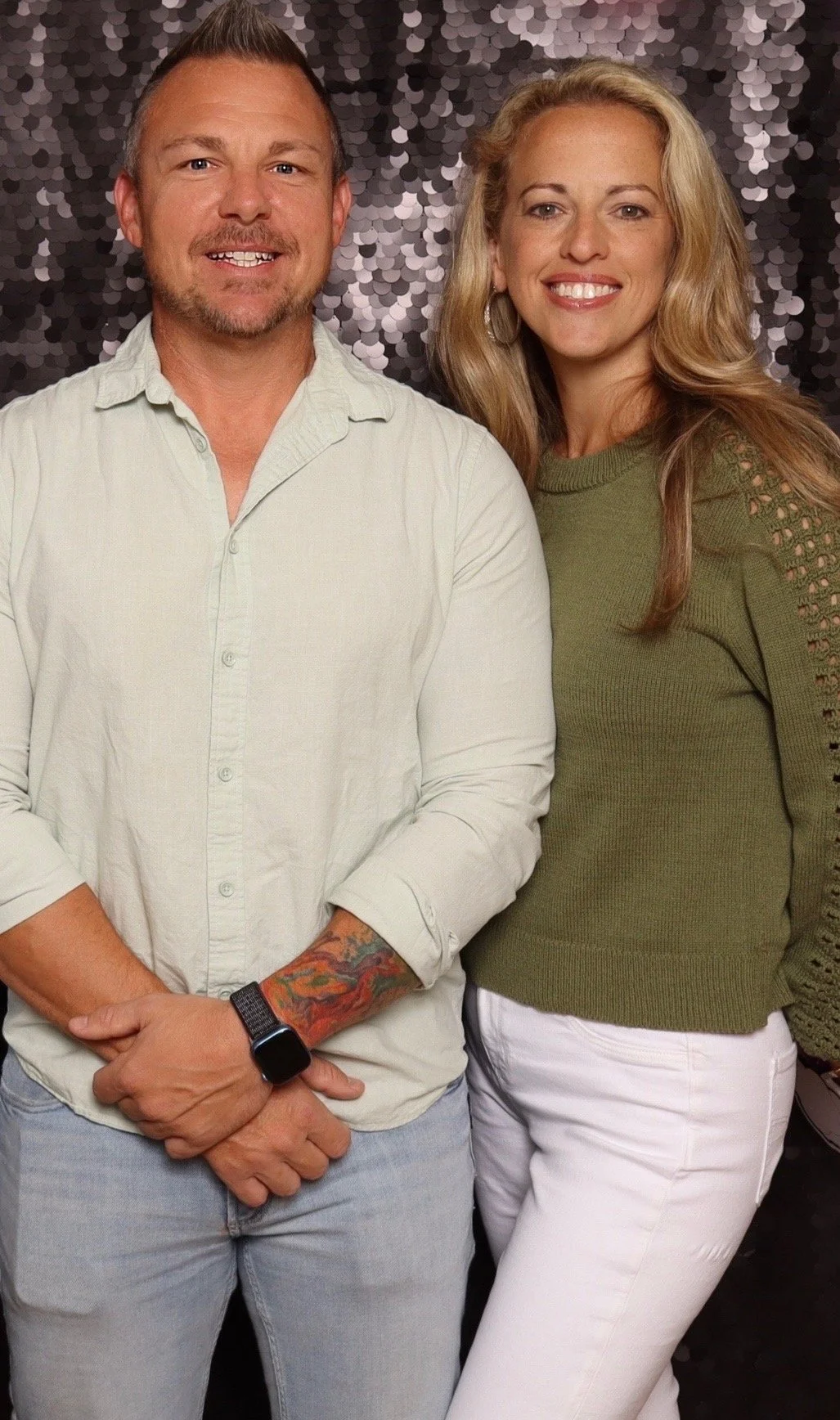 Physical trainer and healthcare provider taking a photo for an event.