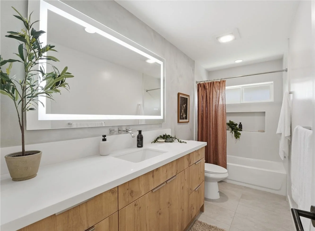 Modern Hawaii Kai bathroom renovation with vanity, mirror, and updated microcement finishes.