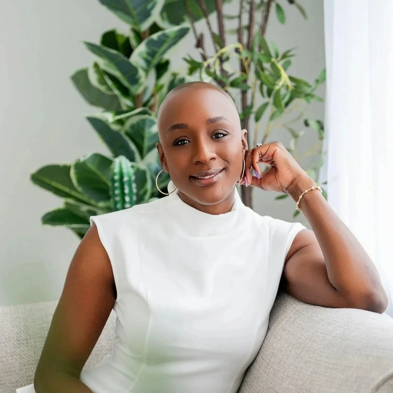 professional african american girl sitting on a couch in business attire
