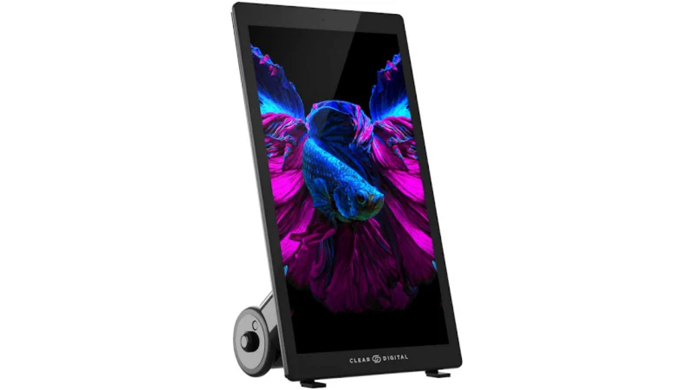 A Sharp digital photo frame displaying an image of a colorful betta fish with vibrant pink, blue, and purple fins.