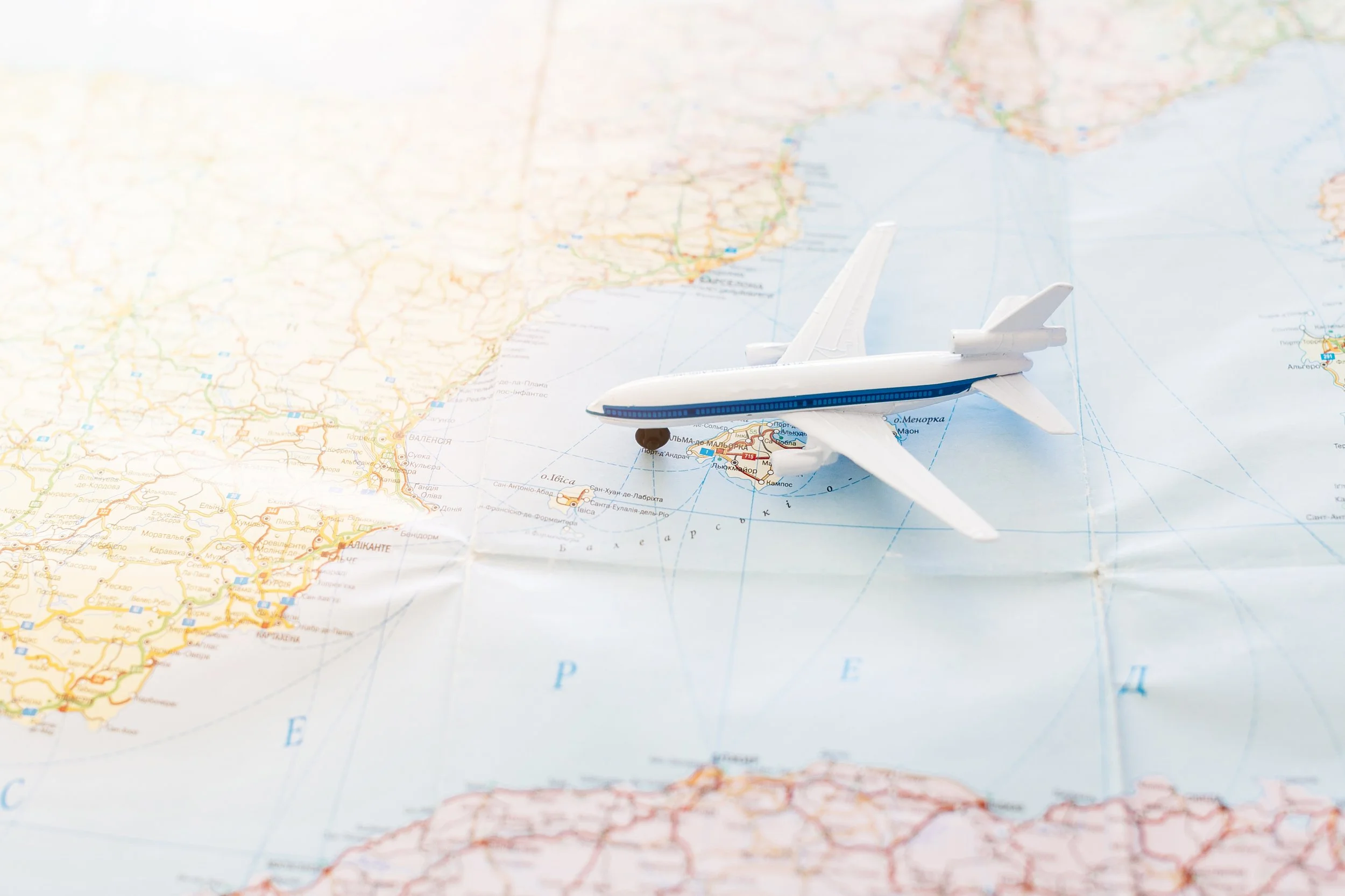 A toy airplane on a map of Greece and surrounding areas.