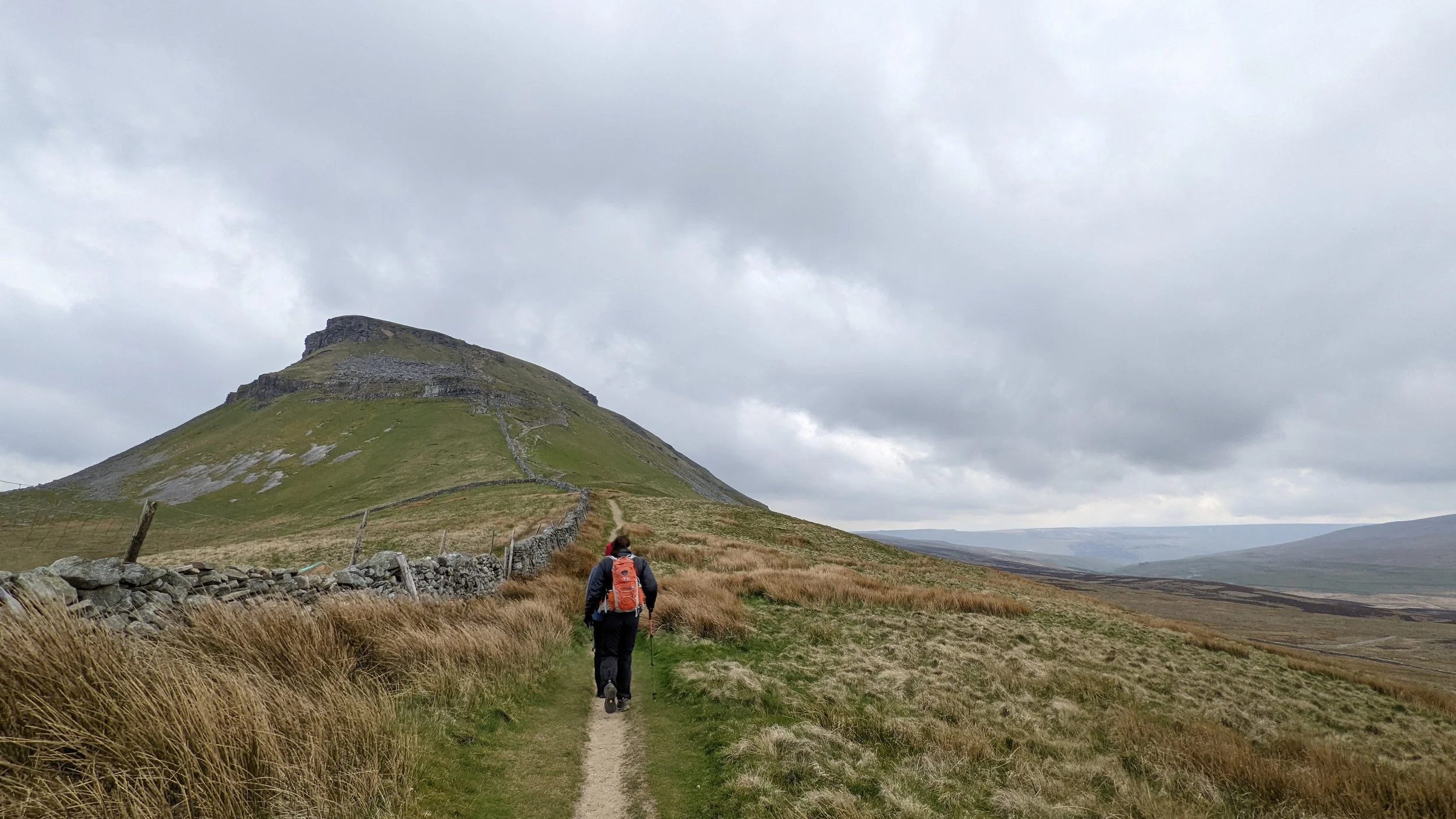 Group of women hiking towards Pen-y-Ghent