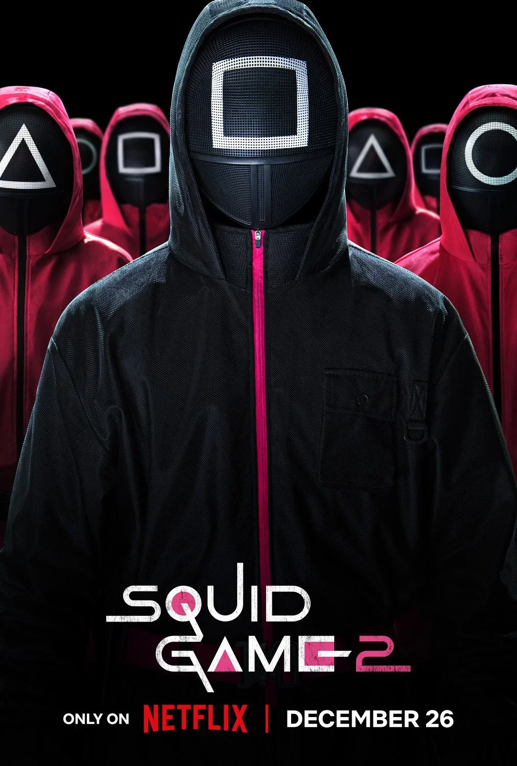 Promotional poster for the television series 'Squid Game 2,' showing a figure in a black hoodie and mask with a square symbol on the face, surrounded by similar figures with different symbols on their masks, against a black background. The text indic