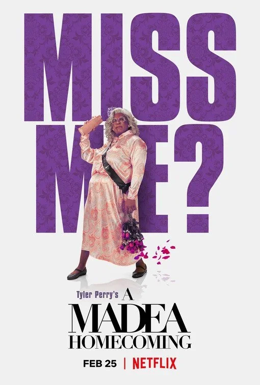 Poster for Tyler Perry's 'A Madea Homecoming' featuring a character dressed as Madea holding a bouquet with petals falling, large purple text saying 'Missed Me?'