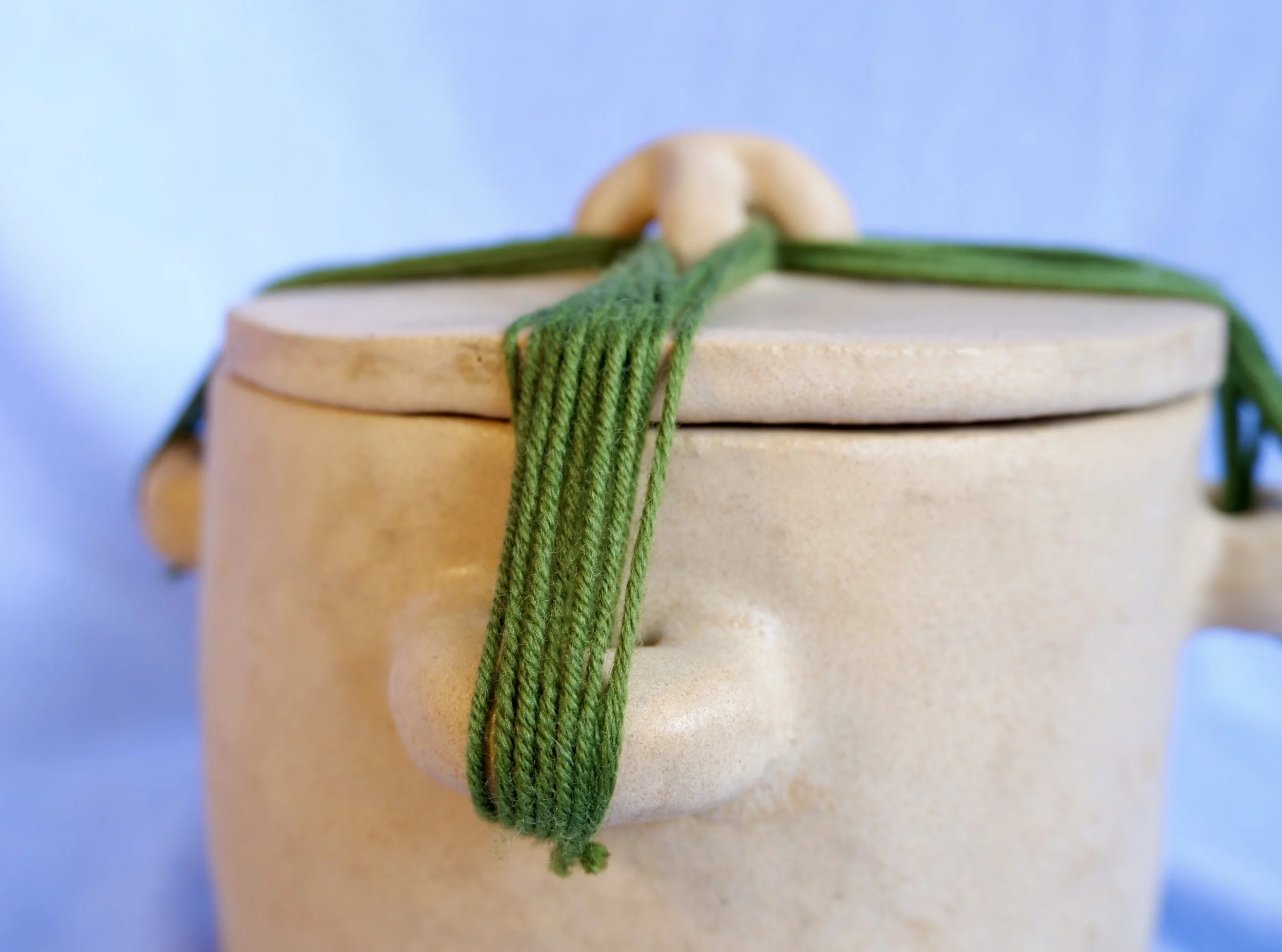 Keep a memory, a secret, a piece of something in here. Seal the jar with an intricate knot, and never open it again. With you forever.