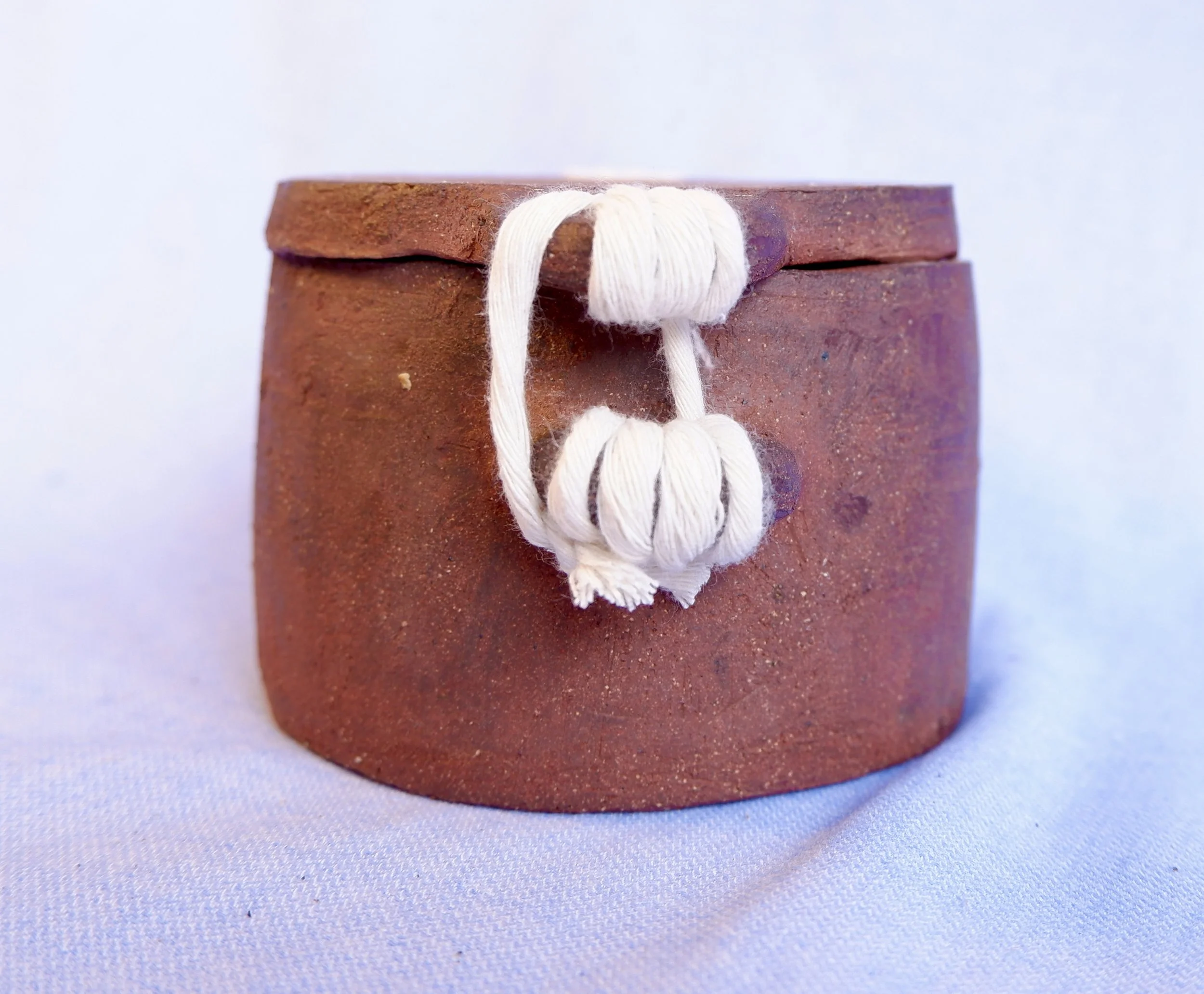 Keep a memory, a secret, a piece of something in here. Seal the jar with an intricate knot, and never open it again. With you forever.
