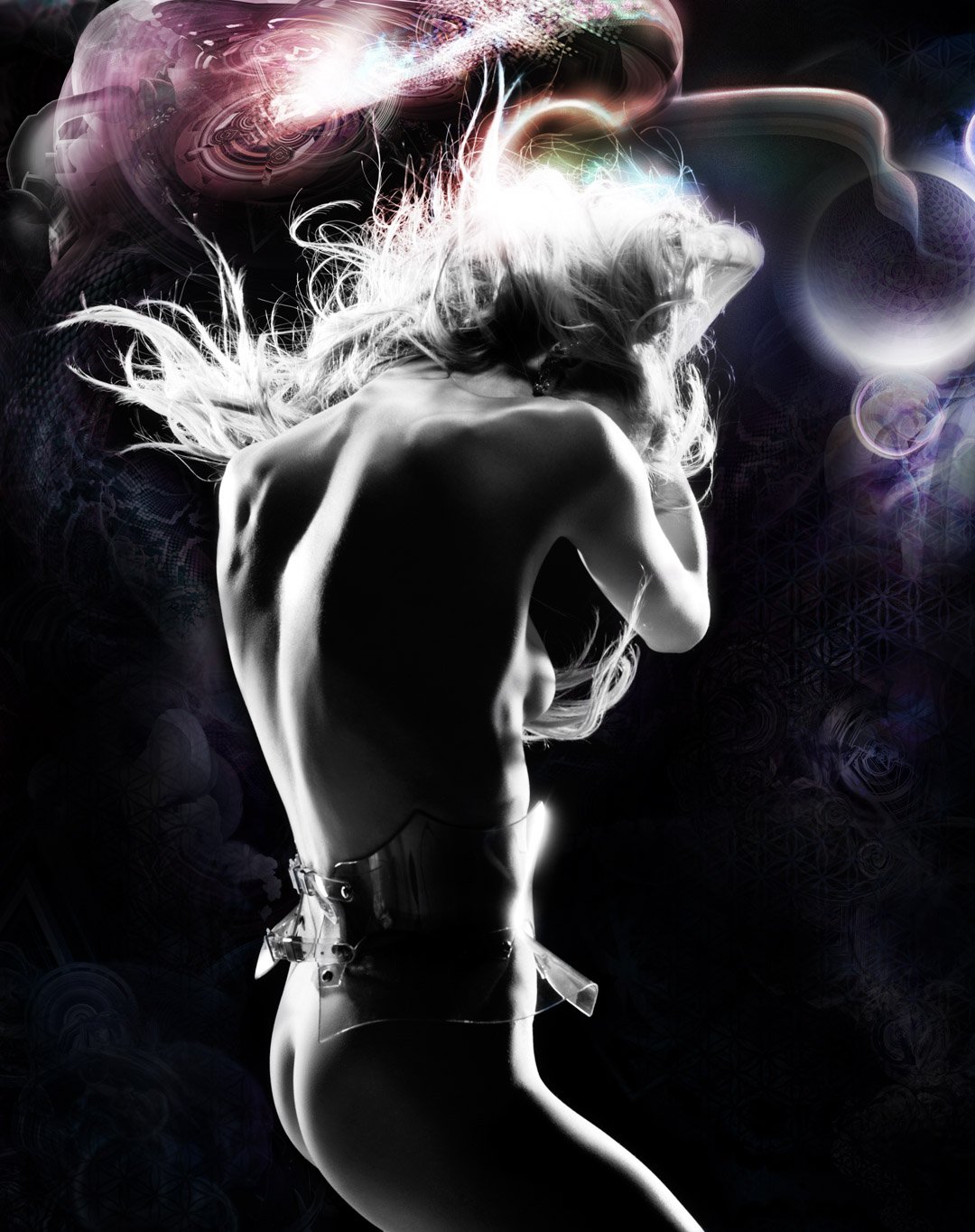 A black and white photo of a woman with long, flowing hair, with her back to the camera, in a dynamic pose, wearing a transparent belt, surrounded by abstract, colorful light effects.