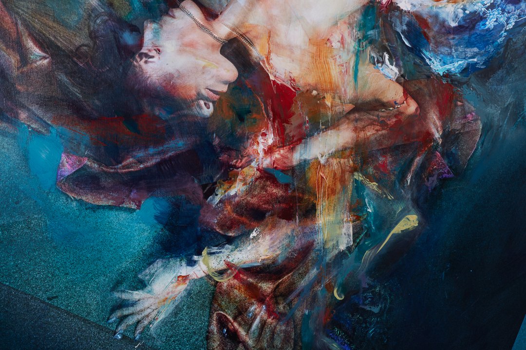 Abstract painting of a woman with dark hair lying down with her eyes closed, featuring vibrant colors and expressive brushstrokes.