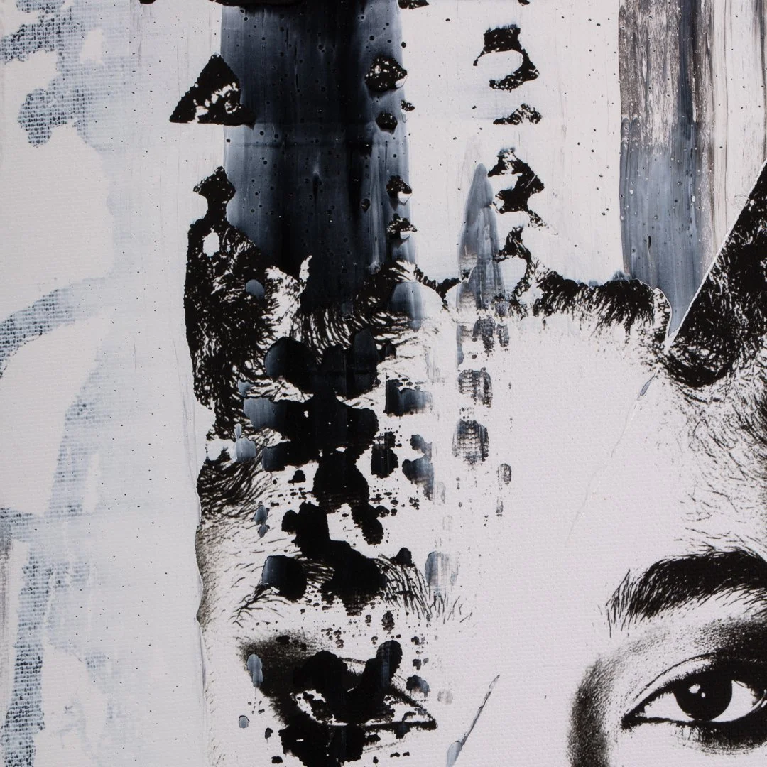 Close-up of a painted portrait of a woman with one eye visible, created with black and white paint in an abstract, splattered style.
