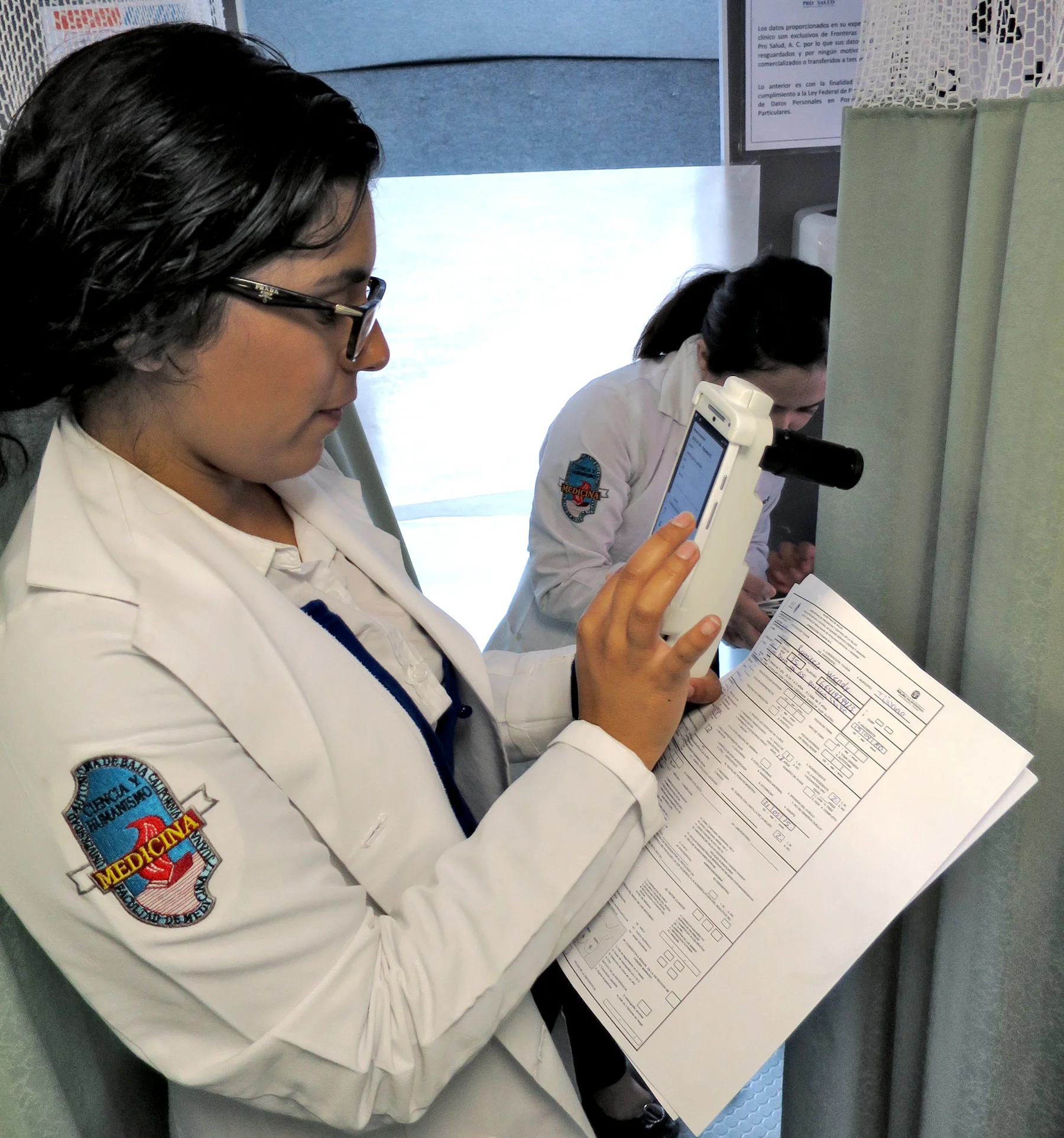Nurse using the EVA device and app.