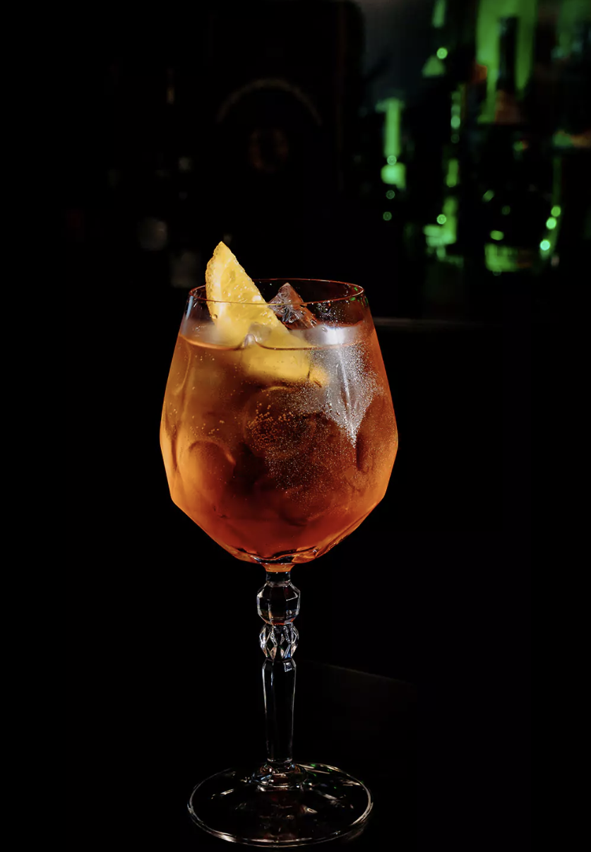 A martini cocktail with olives