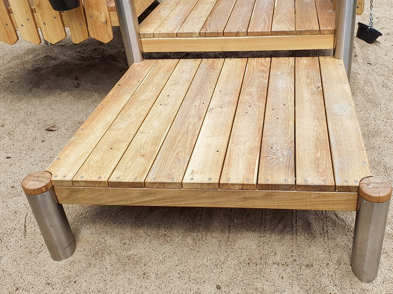 Compact roofed playground set with slide for young children, designed for public outdoor areas and compliant with EN 1176 safety standards.